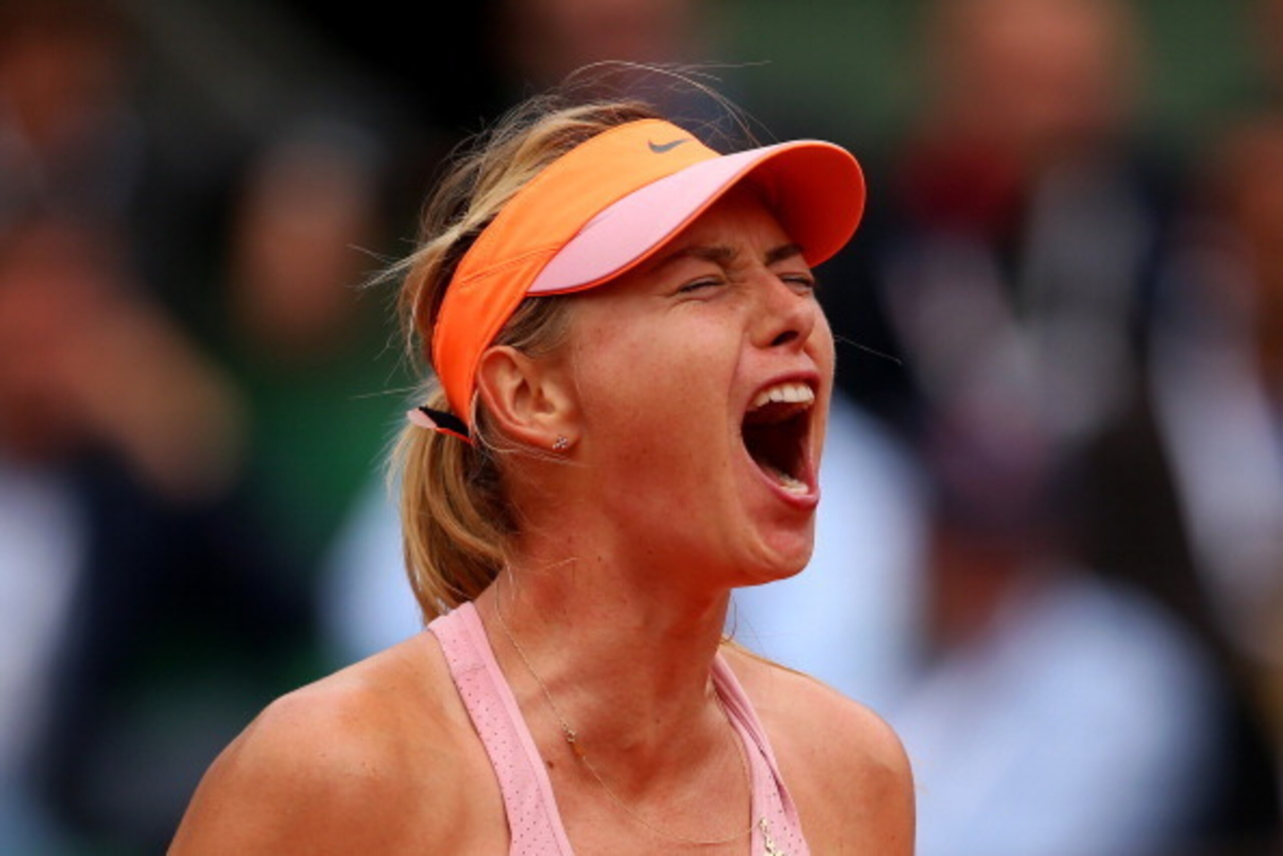 PARIS, FRANCE - JUNE 03:  Maria Sharapova of Russia celebrates a point during her women's singles match against Garbine Muguruza of Spain on day ten of the French Open at Roland Garros on June 3, 2014 in Paris, France.  (Photo by Clive Brunskill/Getty Ima