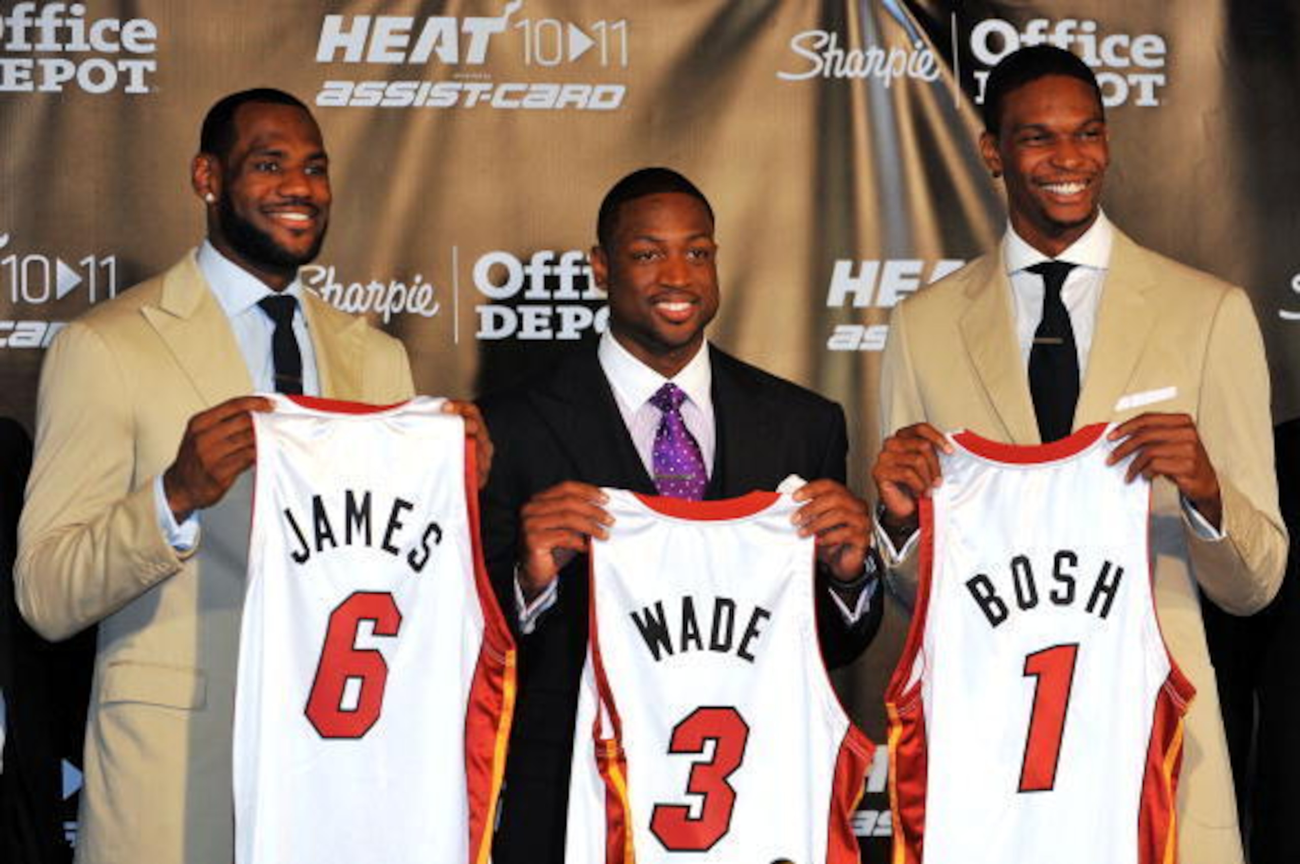 MIAMI - JULY 09:  LeBron James #6, Dwyane Wade #3 and Chris Bosh #1 of the Miami Heat show off their new game jerseys before a press conference after a welcome party at American Airlines Arena on July 9, 2010 in Miami, Florida.  (Photo by Doug Benc/Getty 