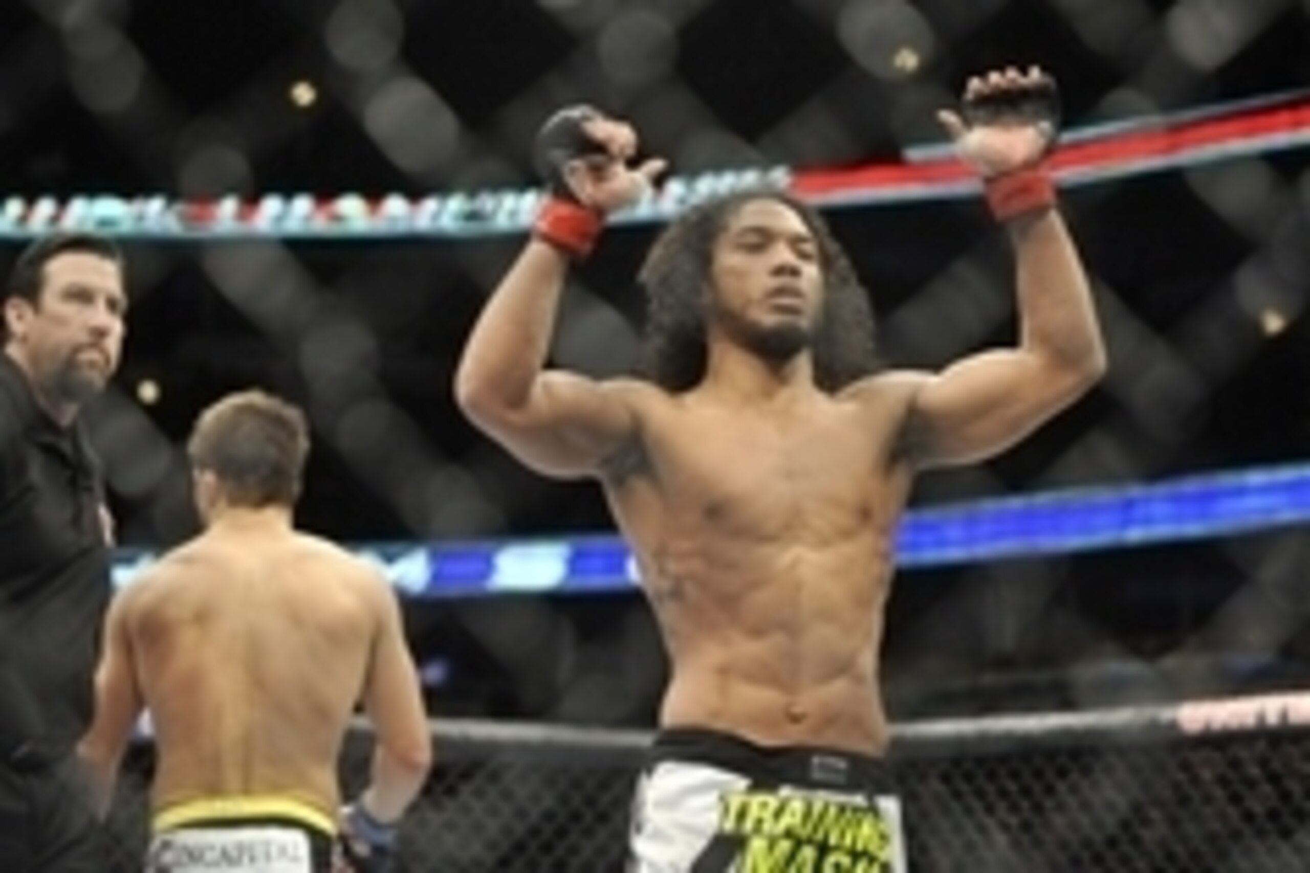 Jan 25, 2014; Chicago, IL, USA; Benson Henderson (red gloves) reacts after defeating Josh Thomson (blue gloves) during UFC on FOX 10 at the United Center. Mandatory Credit: David Banks-USA TODAY Sports