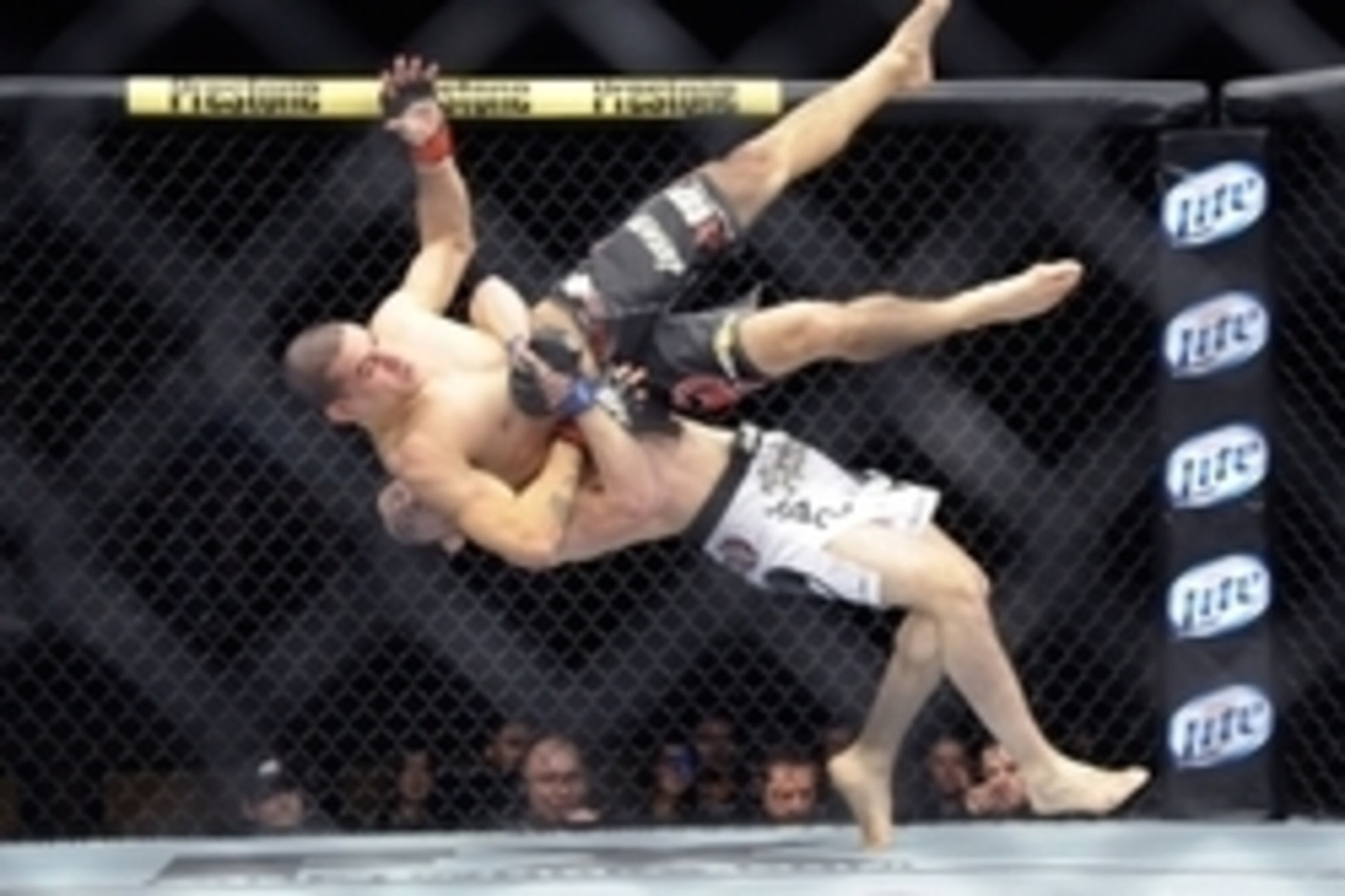 Dec 15, 2012; Las Vegas, NV, USA; Rustam Khabilov (white trunks) slams Vinc Pichel (black trunks) to the mat during their lightweight undercard bout in the Ultimate Fighter Finale at The Joint at  the Hard Rock Hotel and Casino. Khabilov defeated Pichel b