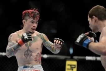 December 14, 2013; Sacramento, CA, USA; Scott Jorgensen (red gloves) fights Zach Makovsky (blue gloves) during the flyweight bout of the UFC on FOX 9 at Sleep Train Arena. Mandatory Credit: Kyle Terada-USA TODAY Sports