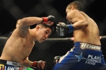 Nov 16, 2013; Las Vegas, NV, USA; Erik Perez (red gloves) fights against Edwin Figueroa (blue gloves) in their bantamweight bout during UFC 167 at MGM Grand Garden Arena. Mandatory Credit: Stephen R. Sylvanie-USA TODAY Sports