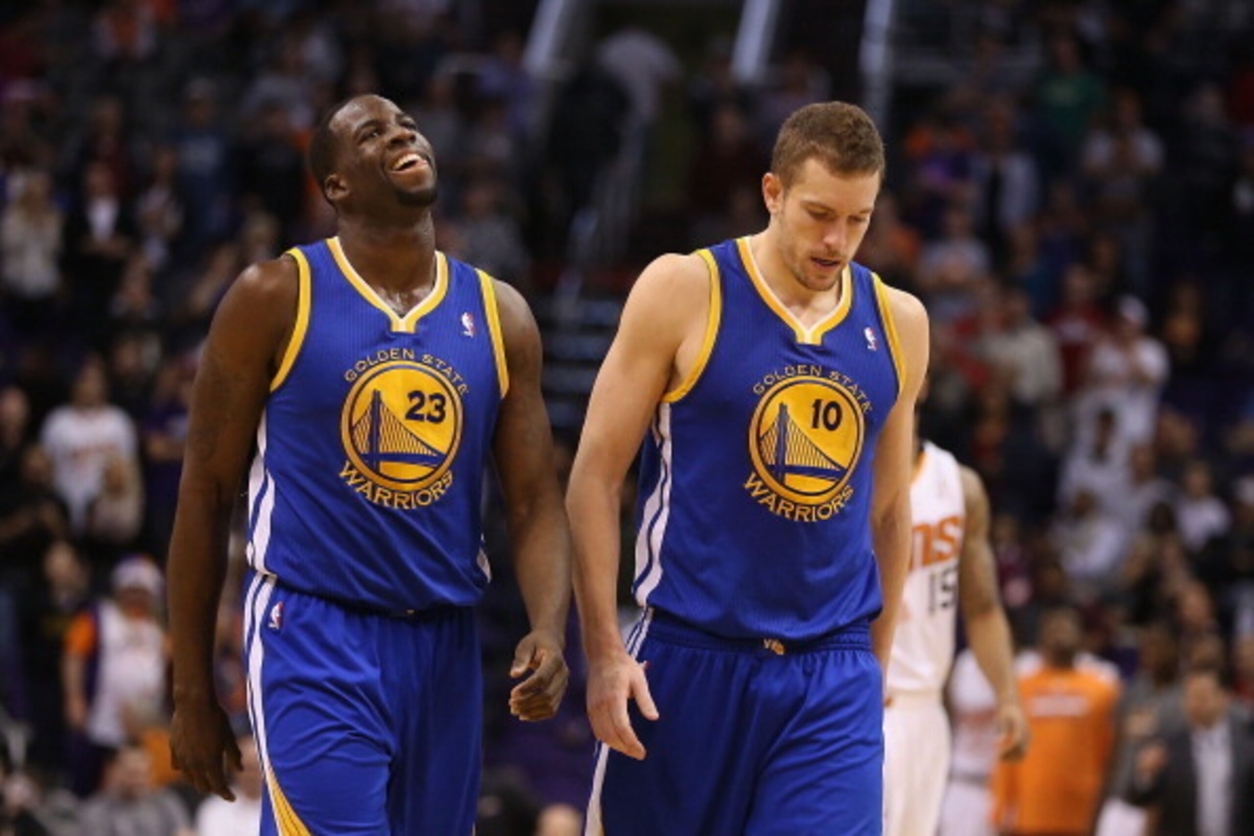 PHOENIX, AZ - DECEMBER 15:  Draymond Green #23 and David Lee #10 of the Golden State Warriors react as they walk down court in the final moments of the NBA game against the Phoenix Suns at US Airways Center on December 15, 2013 in Phoenix, Arizona. The Su