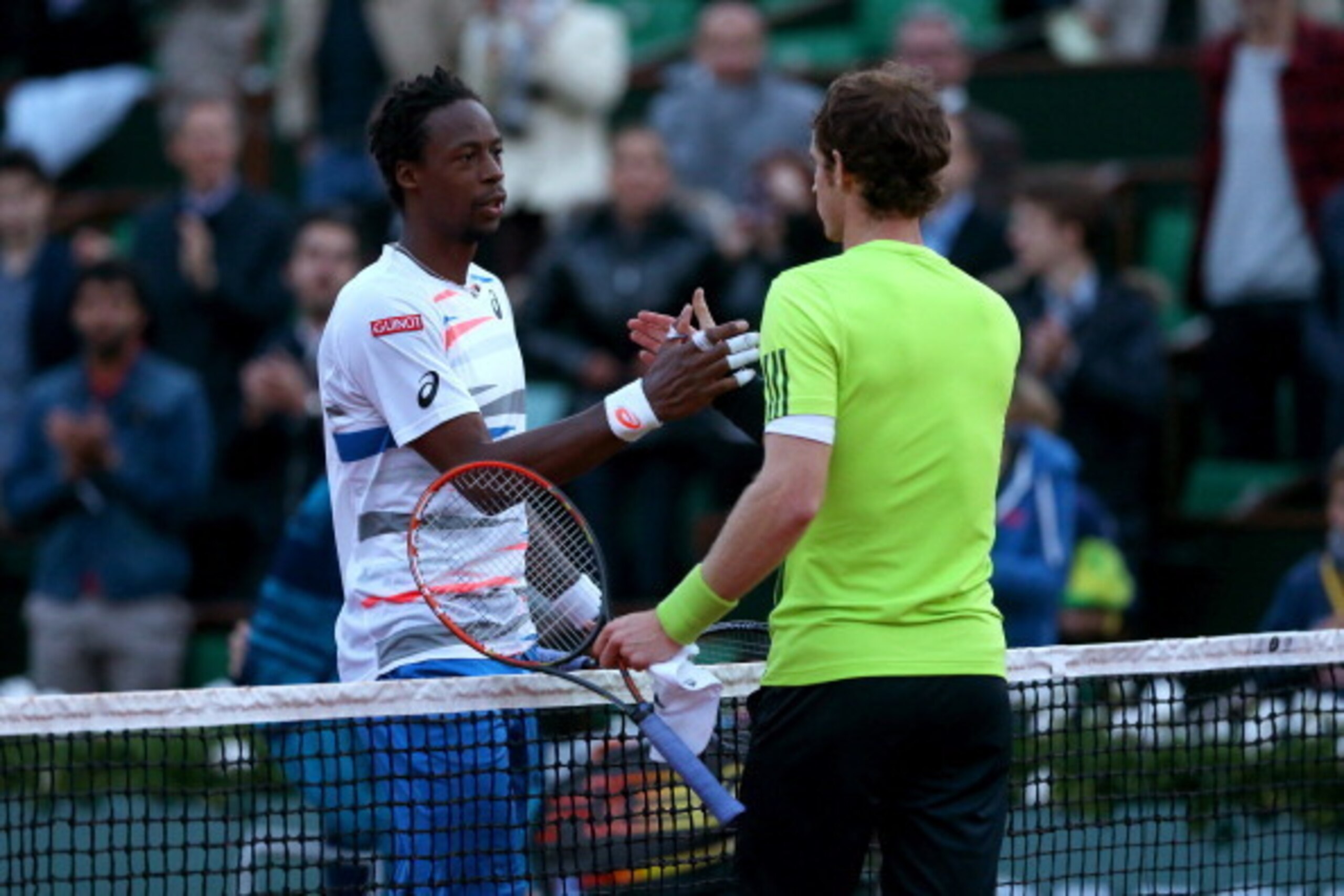 PARIS, FRANCE - JUNE 04:  Andy Murray of Great Britain shakes hands with Gael Monfils of France after their men's singles quarter-final match on day eleven of the French Open at Roland Garros on June 4, 2014 in Paris, France.  (Photo by Matthew Stockman/G