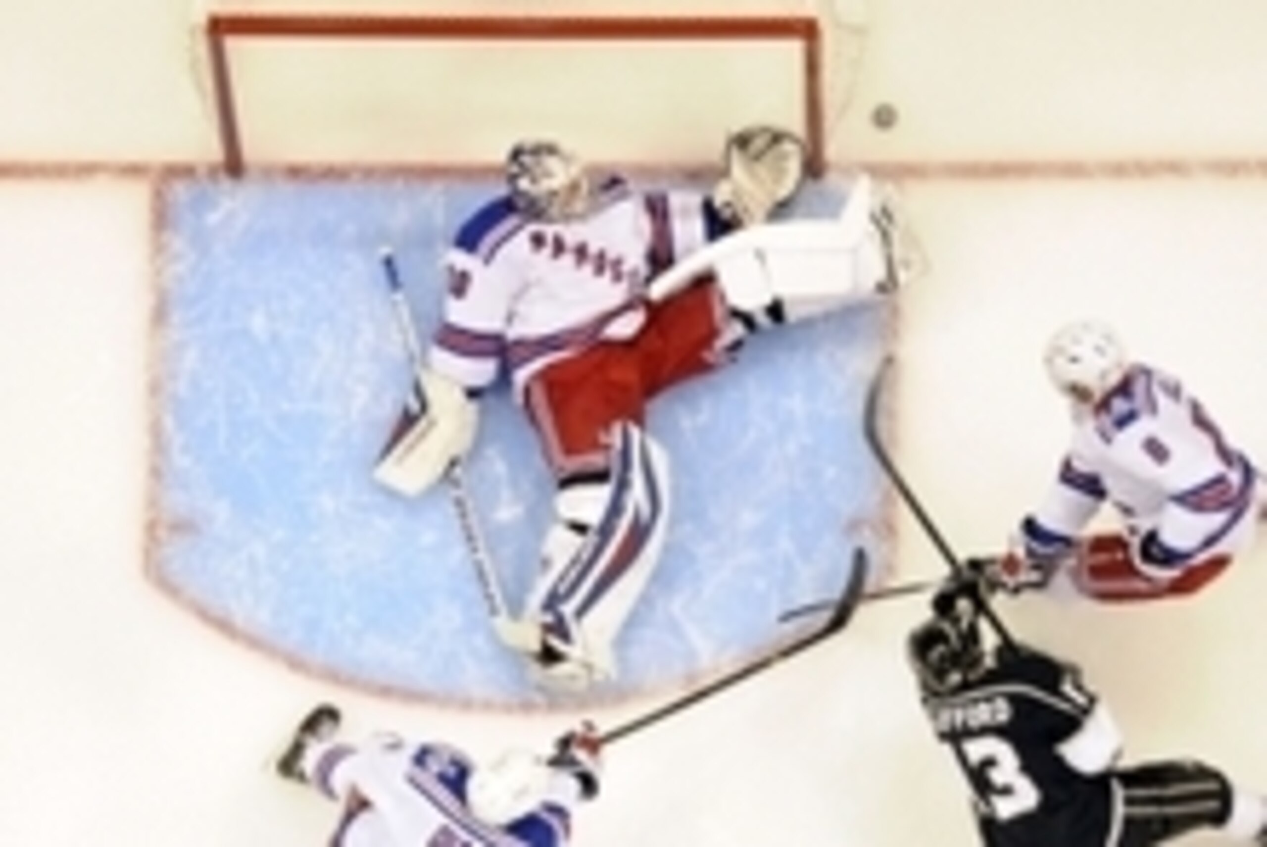 Jun 4, 2014; Los Angeles, CA, USA; New York Rangers goalie Henrik Lundqvist (30) defends the net against Los Angeles Kings left wing Kyle Clifford (13) during the first period in game one of the 2014 Stanley Cup Final at Staples Center. Mandatory Credit: