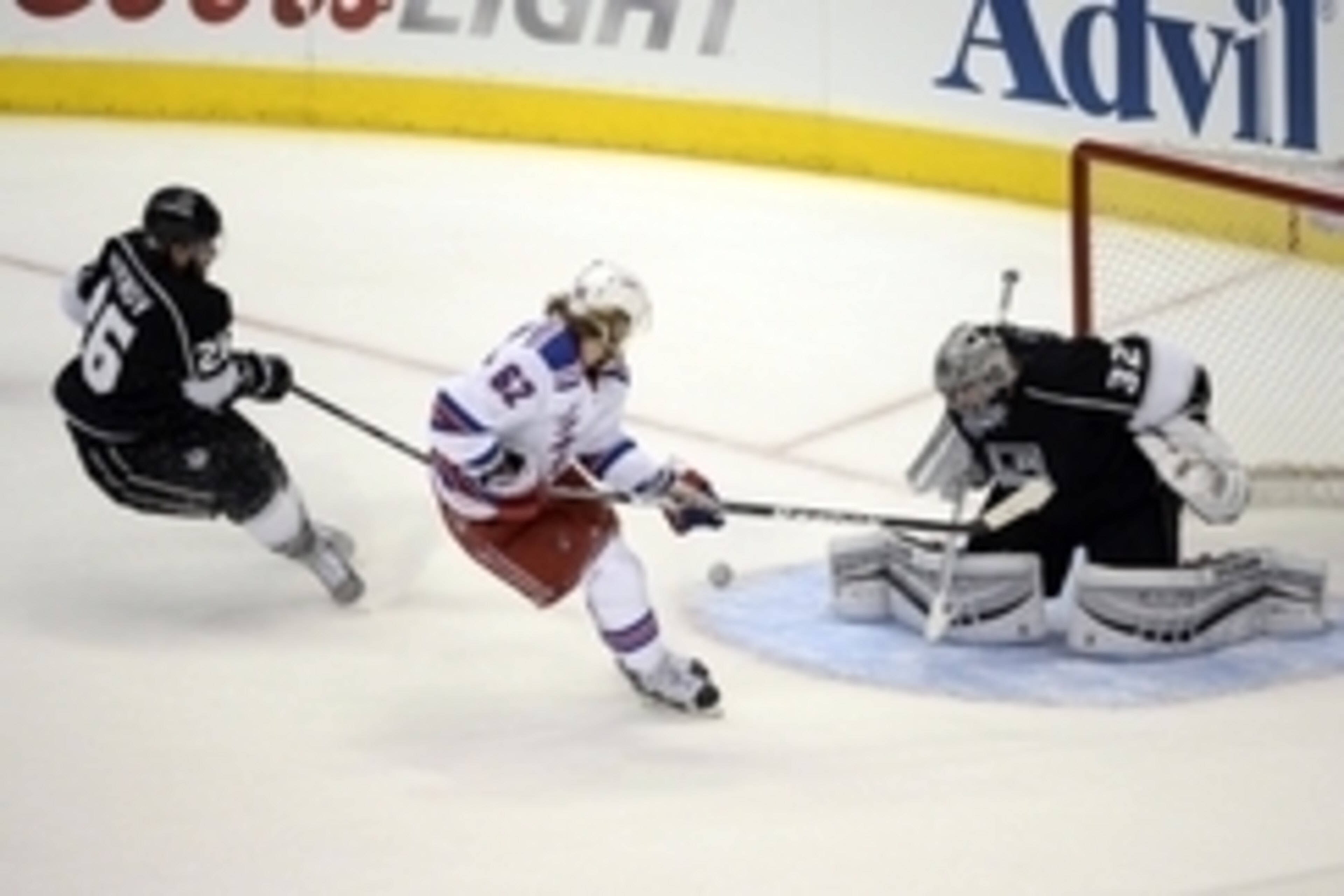 Jun 4, 2014; Los Angeles, CA, USA; New York Rangers left wing Carl Hagelin (62) scores a short-handed goal past Los Angeles Kings goalie Jonathan Quick (32) and defenseman Slava Voynov (26) in the first period during game one of the 2014 Stanley Cup Final Jun 4, 2014; Los Angeles, CA, USA; New York Rangers left wing Carl Hagelin (62) scores a short-handed goal past Los Angeles Kings goalie Jonathan Quick (32) and defenseman Slava Voynov (26) in the first period during game one of the 2014 Stanley Cup Final