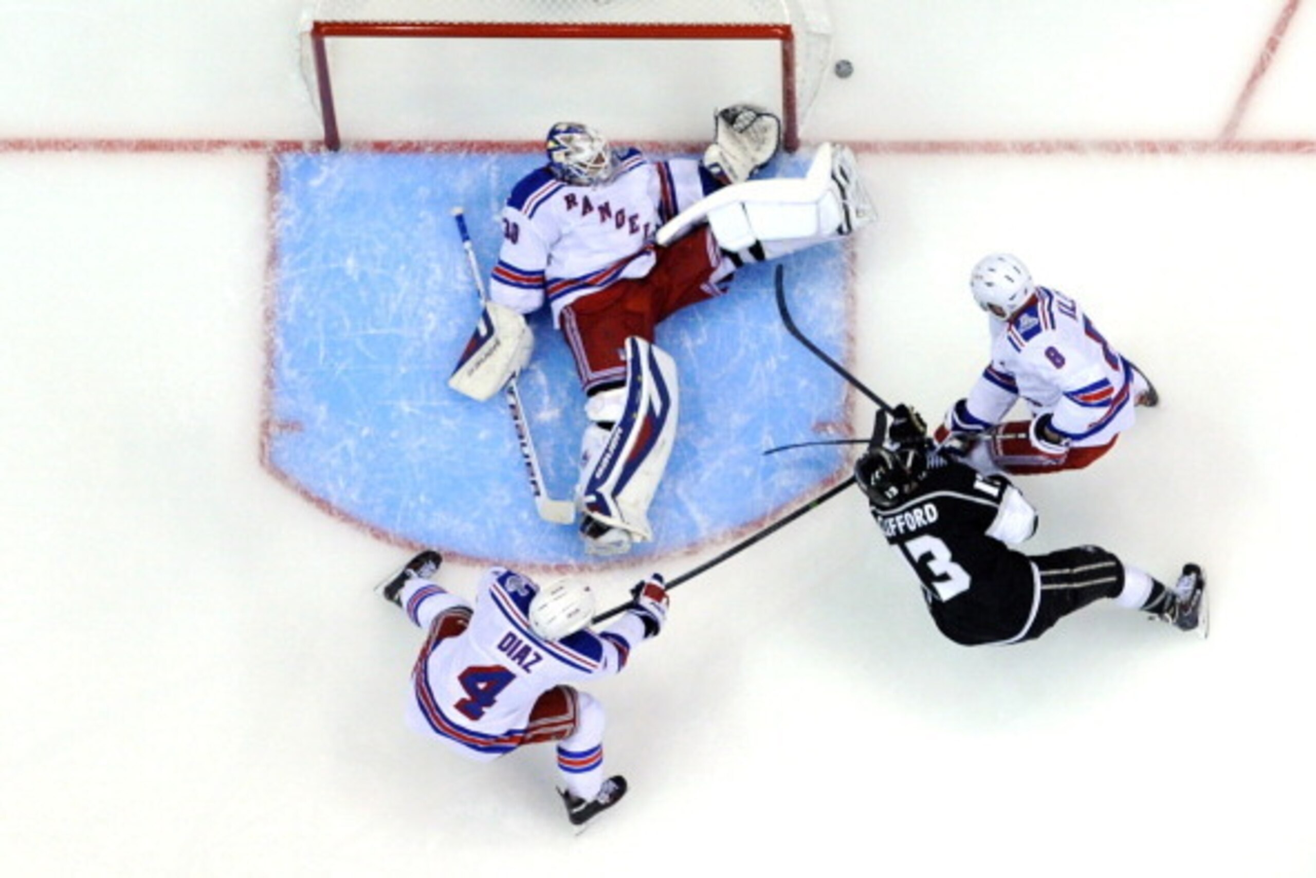 LOS ANGELES, CA - JUNE 04:  Goaltender Henrik Lundqvist #30 of the New York Rangers dives to make a save against Kyle Clifford #13 of the Los Angeles Kings during Game One of the 2014 NHL Stanley Cup Final at the Staples Center on June 4, 2014 in Los Ange
