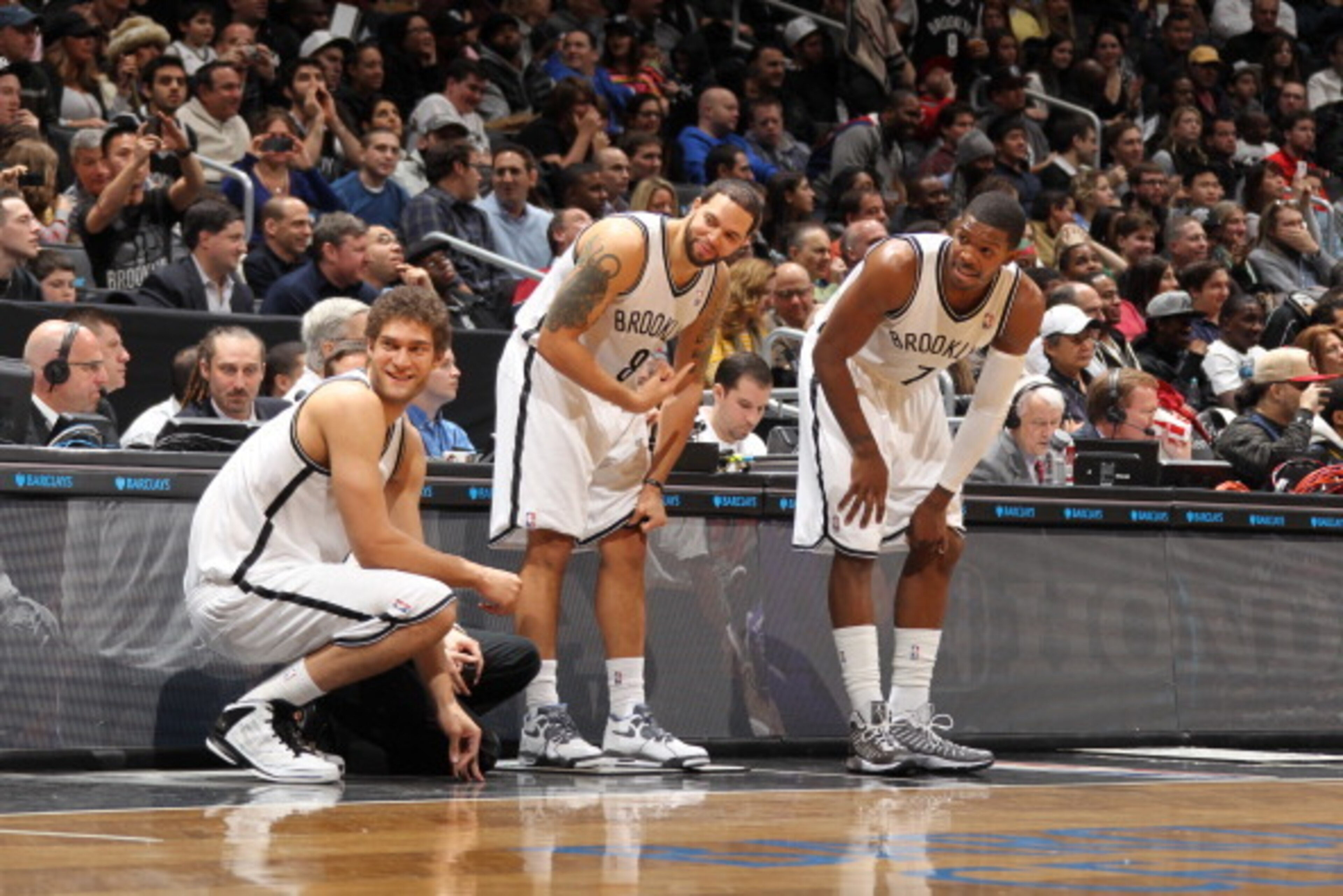 BROOKLYN, NY - JANUARY 5: Brook Lopez #11, Deron Williams #8 and Joe Johnson #7 of the Brooklyn Nets get ready to check in against the Sacramento Kings on January 5, 2013 at the Barclays Center in the Brooklyn borough of New York City. NOTE TO USER: User BROOKLYN, NY - JANUARY 5: Brook Lopez #11, Deron Williams #8 and Joe Johnson #7 of the Brooklyn Nets get ready to check in against the Sacramento Kings on January 5, 2013 at the Barclays Center in the Brooklyn borough of New York City. NOTE TO USER: User