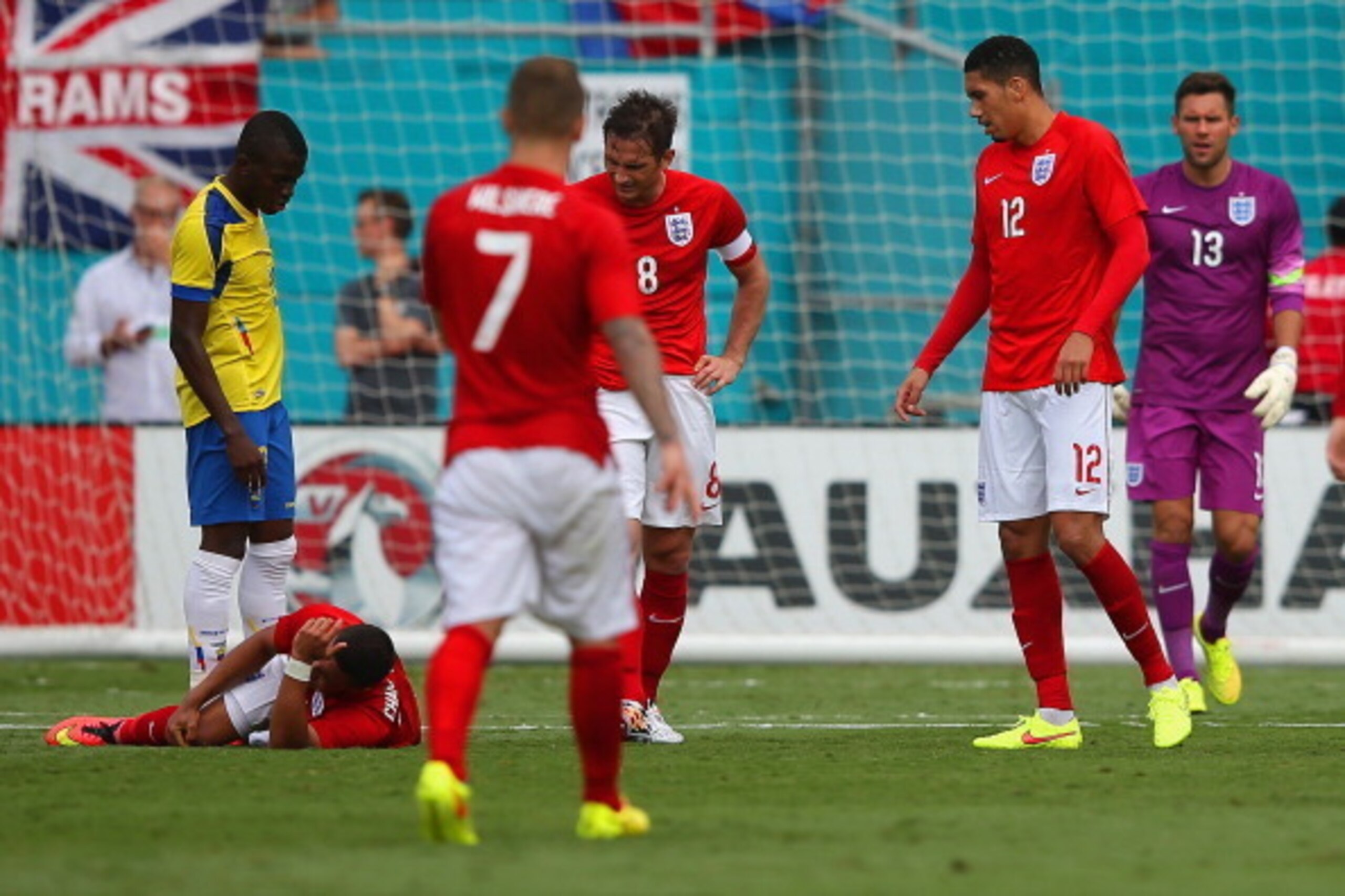 MIAMI GARDENS, FL - JUNE 04:  Frank Lampard of England checks on injured Alex Oxlade-Chamberlain of England as he lies on the pitch during the International friendly match between England and Ecuador at Sun Life Stadium on June 4, 2014 in Miami Gardens, F