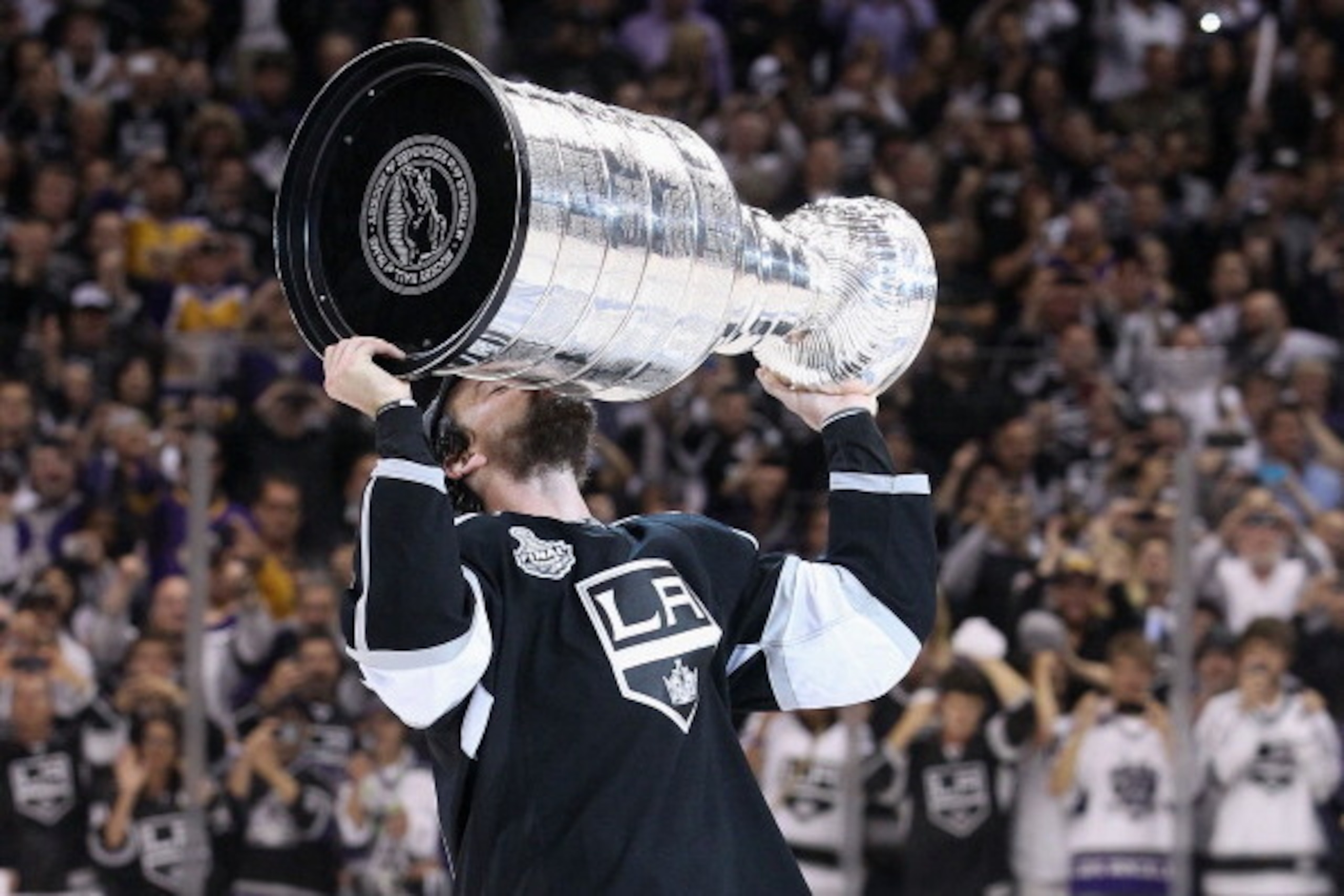 LOS ANGELES, CA - JUNE 11:  Justin Williams #14 of the Los Angeles Kings kisses the Stanley Cup in celebration after defeating the New Jersey Devils in Game Six of the 2012 Stanley Cup Finals at Staples Center on June 11, 2012 in Los Angeles, California. 