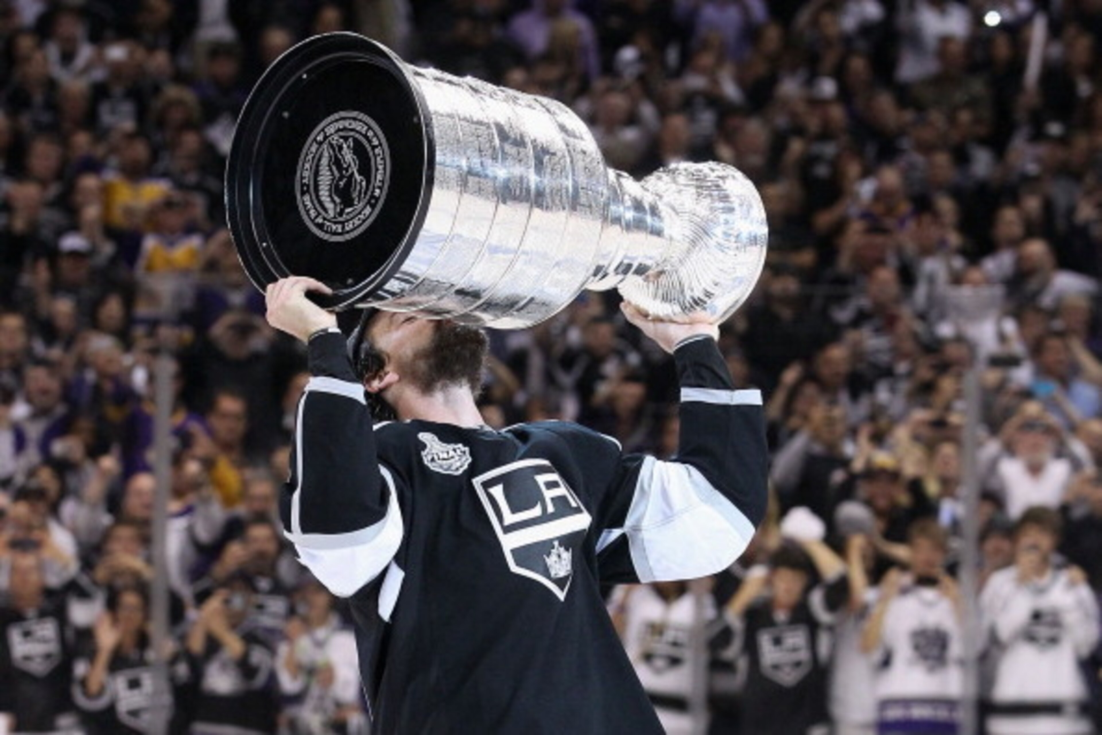 LOS ANGELES, CA - JUNE 11: Justin Williams #14 of the Los Angeles Kings kisses the Stanley Cup in celebration after defeating the New Jersey Devils in Game Six of the 2012 Stanley Cup Finals at Staples Center on June 11, 2012 in Los Angeles, California. LOS ANGELES, CA - JUNE 11: Justin Williams #14 of the Los Angeles Kings kisses the Stanley Cup in celebration after defeating the New Jersey Devils in Game Six of the 2012 Stanley Cup Finals at Staples Center on June 11, 2012 in Los Angeles, California.