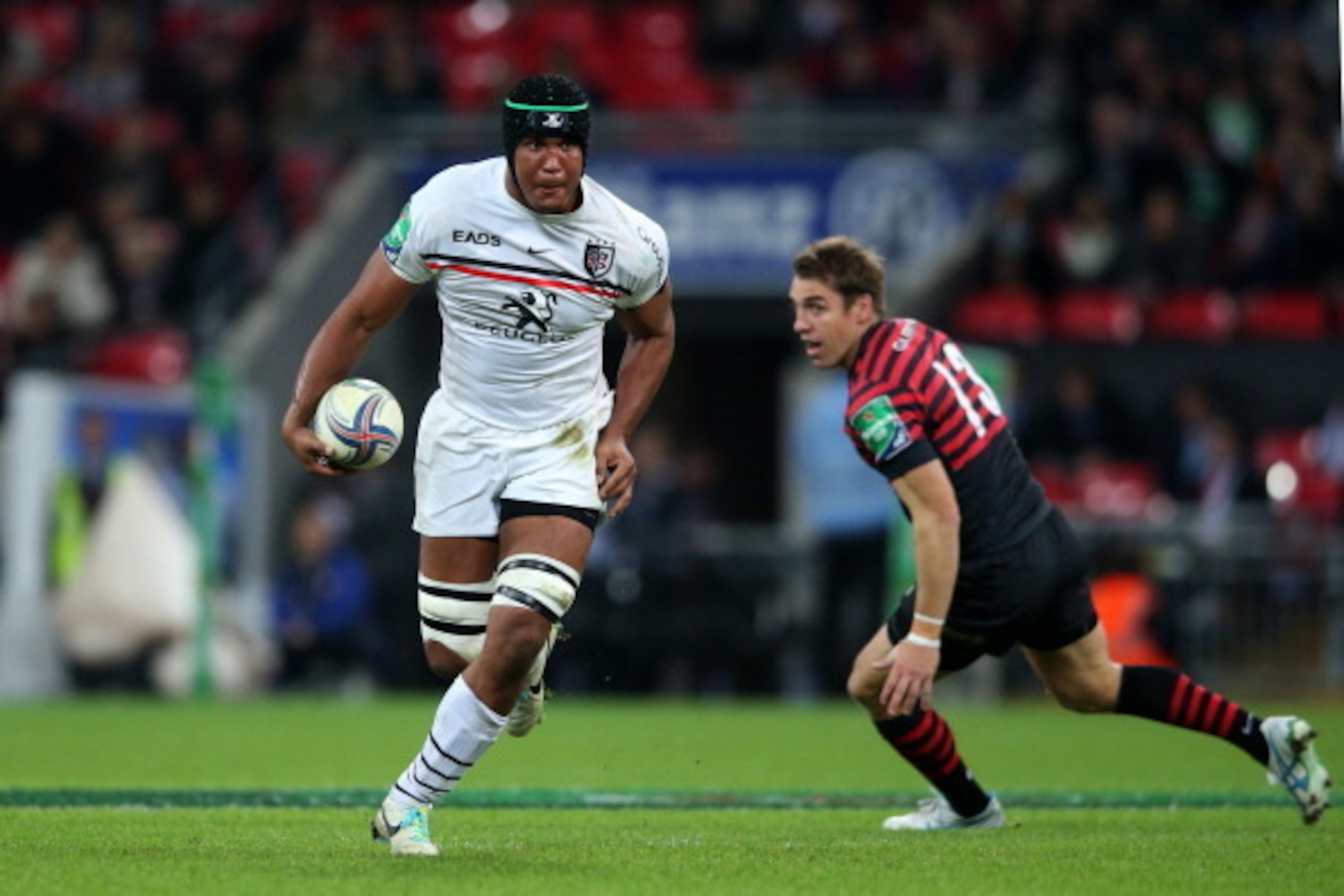 LONDON, ENGLAND - OCTOBER 18:  Thiery Dusautoir of Toulouse Cgoes past Chris Wyles of Saracens during the Heineken Cup pool three match between Saracens and Toulouse at Wembley Stadium on October 18, 2013 in London, England.  (Photo by David Rogers/Getty 
