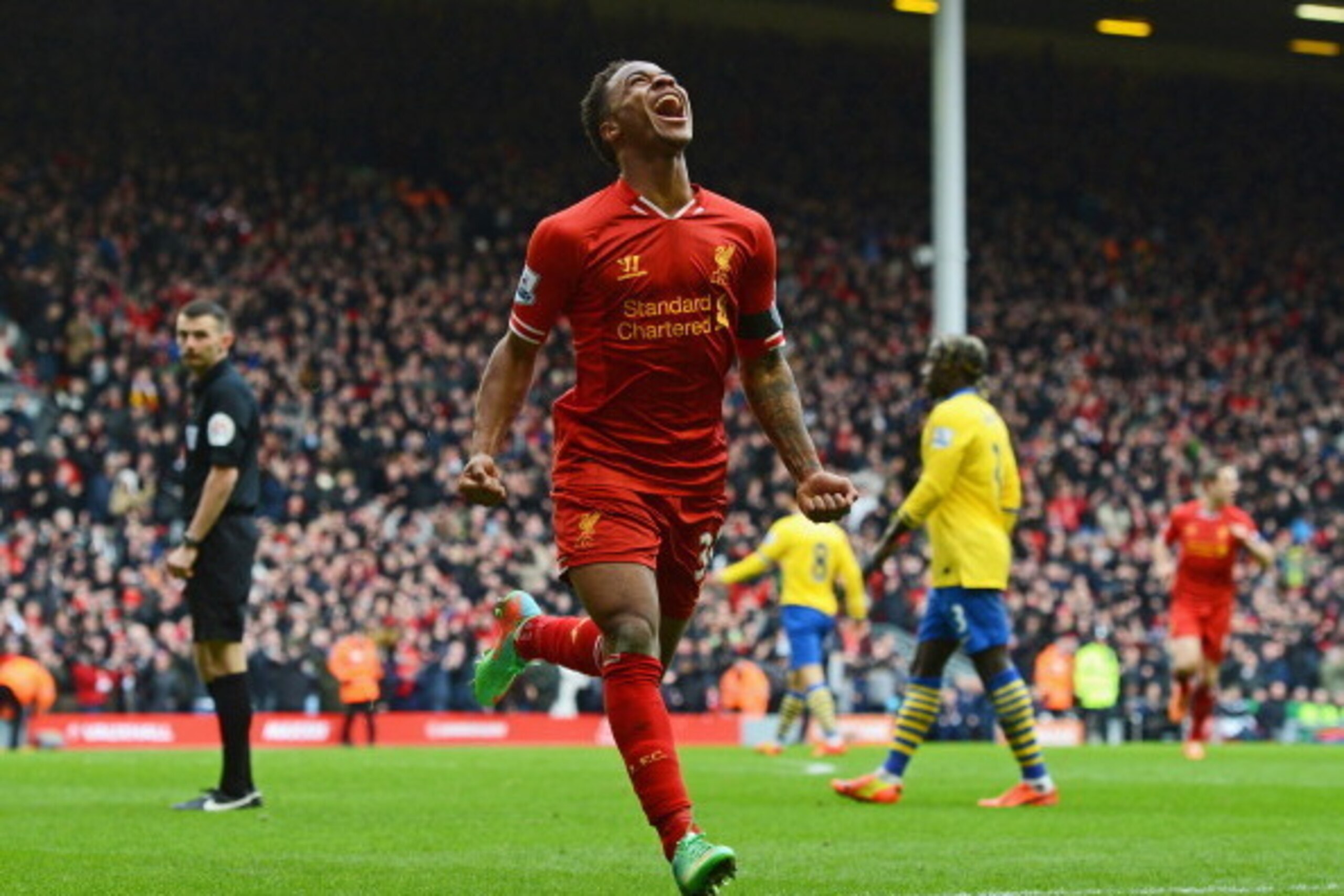 LIVERPOOL, ENGLAND - FEBRUARY 08: Raheem Sterling of Liverpool celebrates scoring the fifth goal during the Barclays Premier League match between Liverpool and Arsenal at Anfield on February 8, 2014 in Liverpool, England. (Photo by Michael Regan/Getty I LIVERPOOL, ENGLAND - FEBRUARY 08: Raheem Sterling of Liverpool celebrates scoring the fifth goal during the Barclays Premier League match between Liverpool and Arsenal at Anfield on February 8, 2014 in Liverpool, England. (Photo by Michael Regan/Getty I