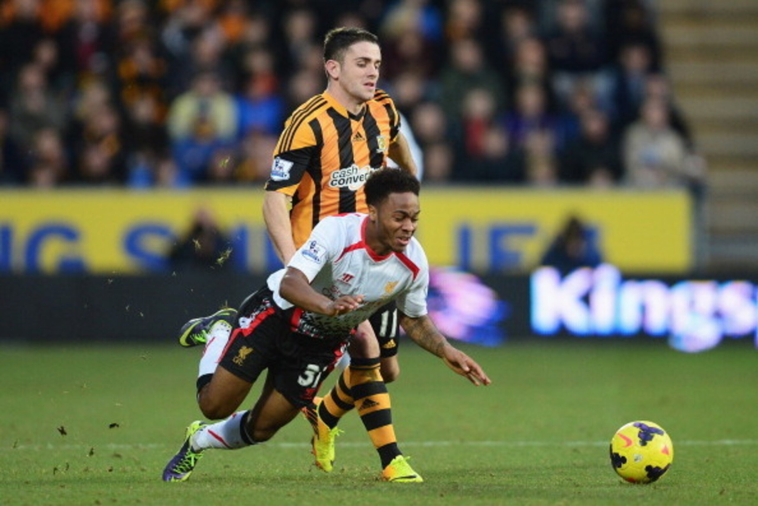 HULL, ENGLAND - DECEMBER 01: Raheem Sterling of Liverpool goes to ground under a challenge from Robbie Brady of Hull City during the Barclays Premier League match between Hull City and Liverpool at KC Stadium on December 1, 2013 in Hull, England. (Photo HULL, ENGLAND - DECEMBER 01: Raheem Sterling of Liverpool goes to ground under a challenge from Robbie Brady of Hull City during the Barclays Premier League match between Hull City and Liverpool at KC Stadium on December 1, 2013 in Hull, England. (Photo