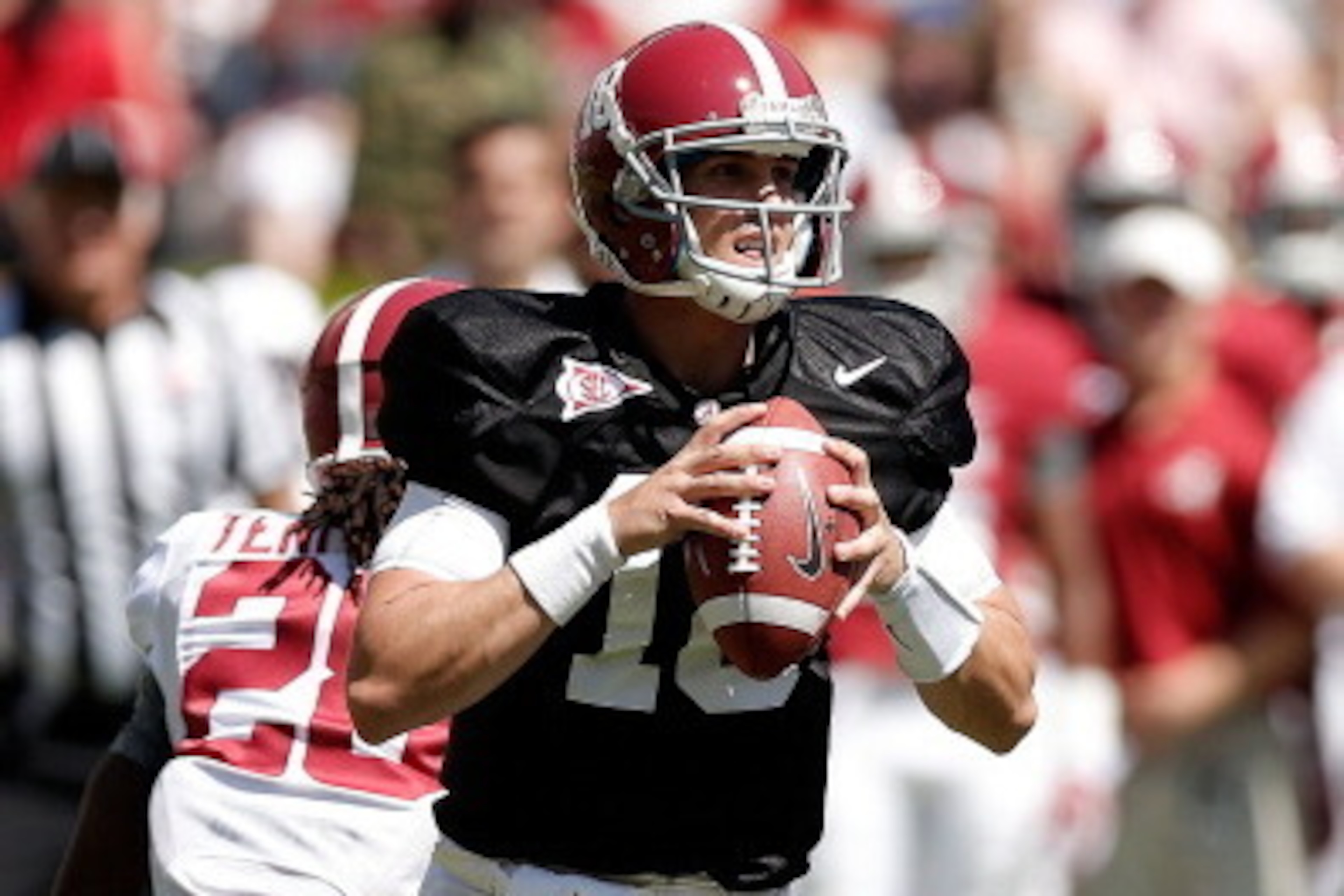 TUSCALOOSA, AL - APRIL 19:  Cooper Bateman #18 of the White team drops back to pass against the Crimson team during the University of Alabama A-Day spring game at Bryant-Denny Stadium on April 19, 2014 in Tuscaloosa, Alabama.  (Photo by Stacy Revere/Getty