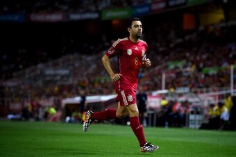 SEVILLE, SPAIN - MAY 30:  Xavi Hernandez of Spain looks on during an international friendly match between Spain and Bolivia at Estadio Ramon Sanchez Pizjuan on May 30, 2014 in Seville, Spain.  (Photo by David Ramos/Getty Images)