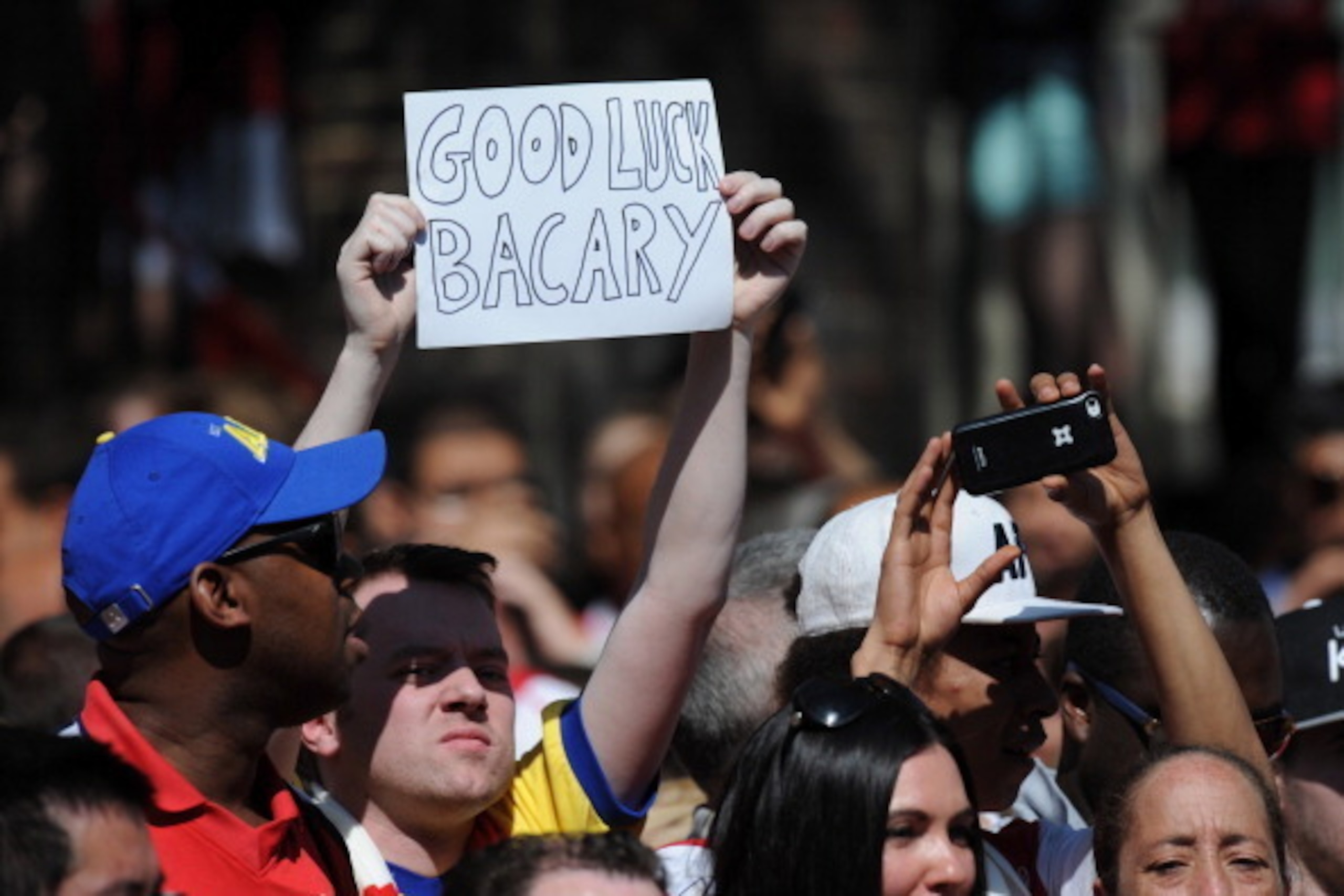 LONDON, ENGLAND - MAY 18: Arsenal supporters show their support for Bacary Sagna as they wait for the Arsenal team bus during the Arsenal FA Cup Victory Parade in Islington, London on May 18, 2014 in London, England. (Photo by Steve Bardens/Getty Images)