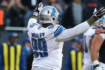 CHICAGO, IL - NOVEMBER 10: C.J. Mosley #99 of the Detroit Lions celebrates after the Chicago Bears are unavble to complete a two-point coversion at the end of the game at Soldier Field on November 10, 2013 in Chicago, Illinois. The Lions defeated the bear
