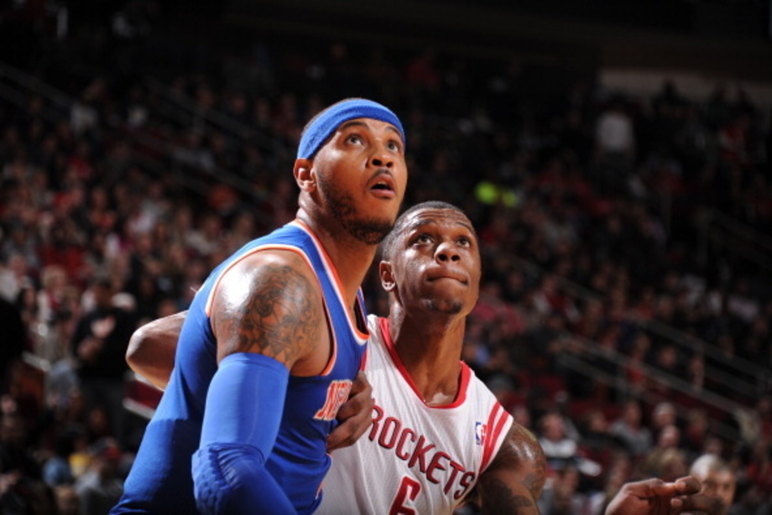 HOUSTON, TX - JANUARY 3:  Carmelo Anthony #7 of the New York Knicks and Terrence Jones #6 of the Houston Rockets battle for the rebound on January 3, 2014 at the Toyota Center in Houston, Texas. NOTE TO USER: User expressly acknowledges and agrees that, b