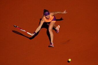 PARIS, FRANCE - JUNE 05:  Simona Halep of Romania returns a shot during her women's singles match against Andrea Petkovic of Germany on day twelve of the French Open at Roland Garros on June 5, 2014 in Paris, France.  (Photo by Clive Brunskill/Getty Image