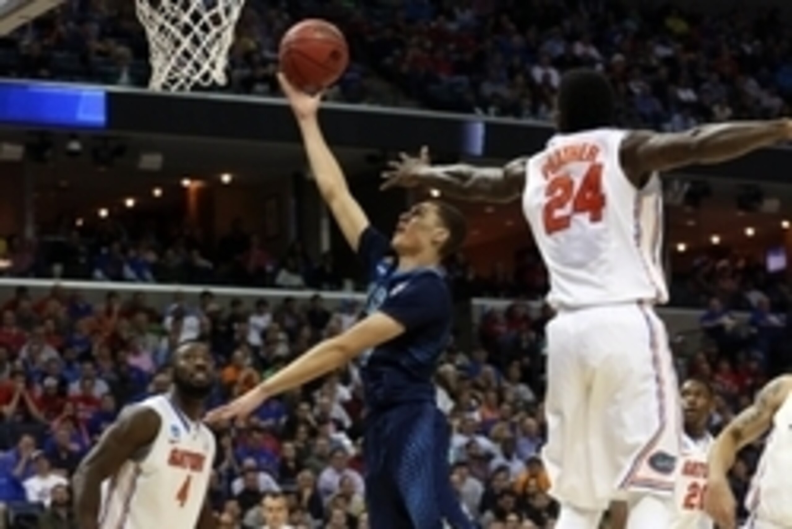 Mar 27, 2014; Memphis, TN, USA; UCLA Bruins guard Zach LaVine (14) lays the ball up ahead of Florida Gators forward Casey Prather (24) during the first half in the semifinals of the south regional of the 2014 NCAA Mens Basketball Championship tournament a