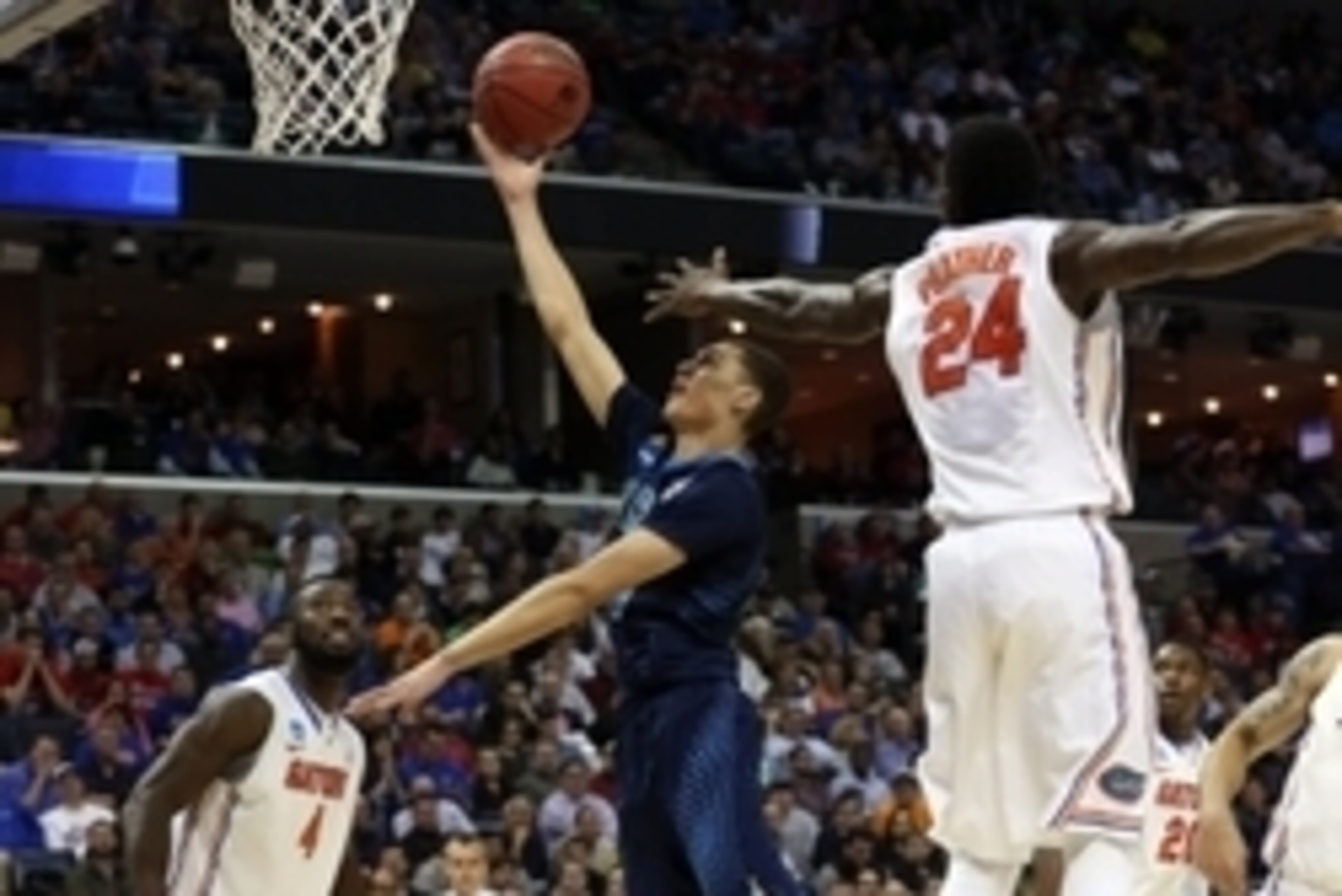 Mar 27, 2014; Memphis, TN, USA; UCLA Bruins guard Zach LaVine (14) lays the ball up ahead of Florida Gators forward Casey Prather (24) during the first half in the semifinals of the south regional of the 2014 NCAA Mens Basketball Championship tournament a