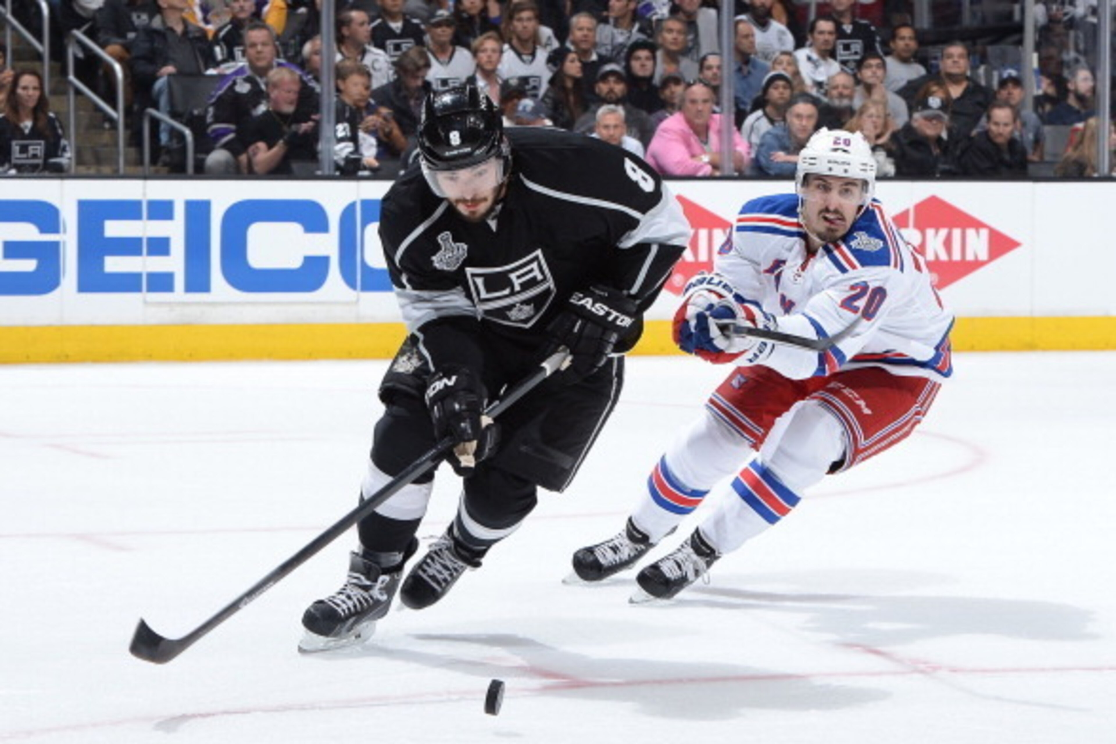 LOS ANGELES, CA - JUNE 4: Drew Doughty #8 of the Los Angeles Kings skates with the puck against Chris Kreider #20 of the New York Rangers in Game One of the Stanley Cup Final during the 2014 Stanley Cup Playoffs at Staples Center on June 4, 2014 in Los A LOS ANGELES, CA - JUNE 4: Drew Doughty #8 of the Los Angeles Kings skates with the puck against Chris Kreider #20 of the New York Rangers in Game One of the Stanley Cup Final during the 2014 Stanley Cup Playoffs at Staples Center on June 4, 2014 in Los A