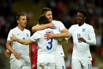 LONDON, ENGLAND - MAY 30:  Gary Cahill of England celebrates scoring their second goal with Leighton Baines, Phil Jagielka and Danny Welbeck of England uring the international friendly match between England and Peru at Wembley Stadium on May 30, 2014 in L