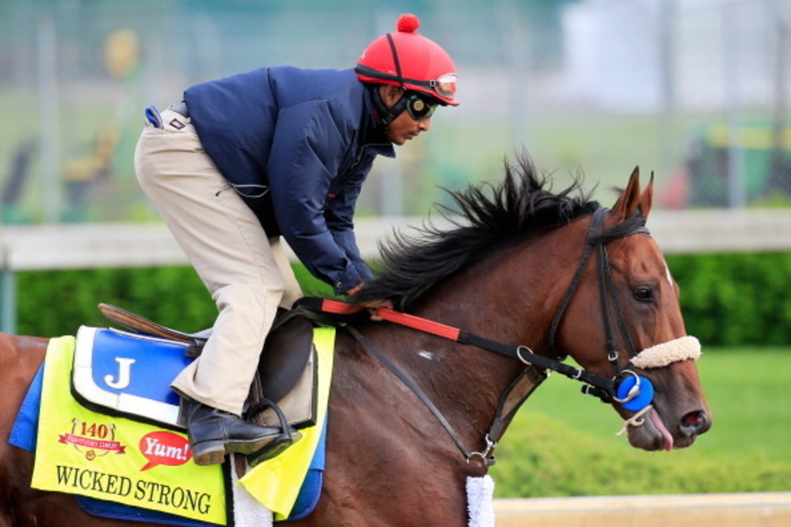 LOUISVILLE, KY - APRIL 29: Wicked Strong is ridden by Kelvin Pahal during the morning exercise session in preparation for the140th Kentucky Derby at Churchill Downs on April 29, 2014 in Louisville, Kentucky.  (Photo by Rob Carr/Getty Images)