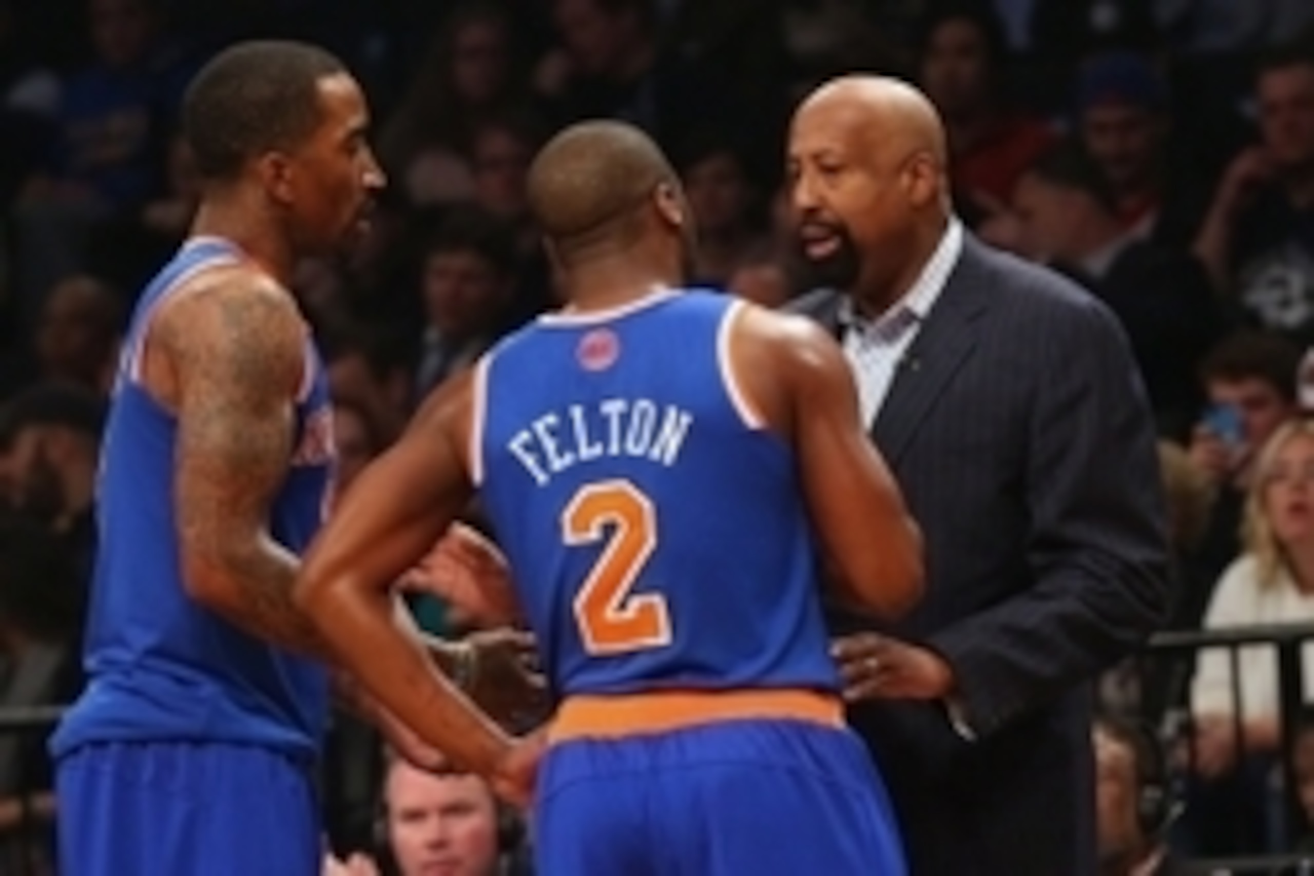 Apr 15, 2014; Brooklyn, NY, USA; New York Knicks head coach Mike Woodson talks with guard Raymond Felton (2)   and guard J.R. Smith (8) during the first quarter against the Brooklyn Nets at Barclays Center. Mandatory Credit: Anthony Gruppuso-USA TODAY Spo