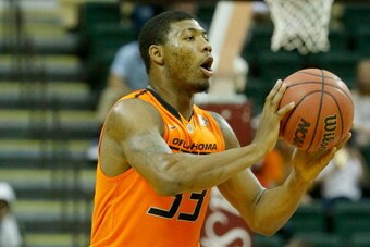 ORLANDO, FL - DECEMBER 01:  Marcus Smart #33 of the Oklahoma State Cowboys in action during the Old Spice Classic against the Memphis Tigers at HP Field House on December 1, 2013 in Orlando, Florida.  (Photo by Sam Greenwood/Getty Images)