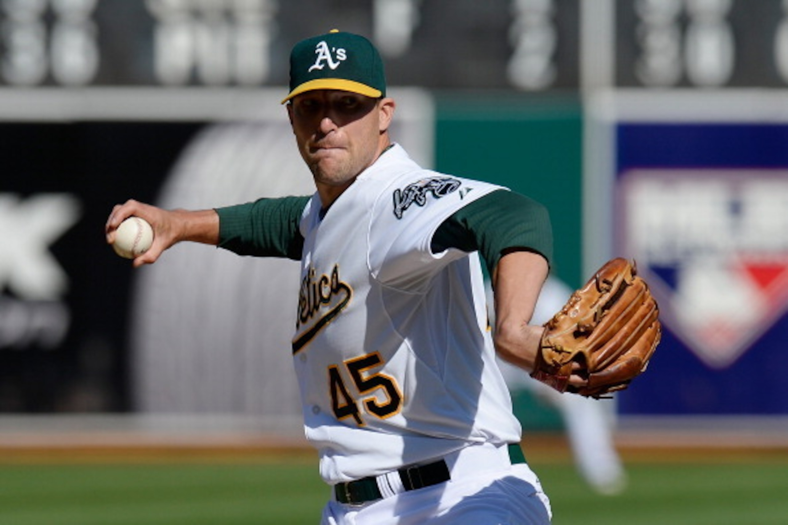 OAKLAND, CA - APRIL 06: Jim Johnson #45 of the Oaklandn Athletics against the Seattle Mariners in the ninth inning at O.co Coliseum on April 6, 2014 in Oakland, California. The Athletics won the game 6-3. (Photo by Thearon W. Henderson/Getty Images)