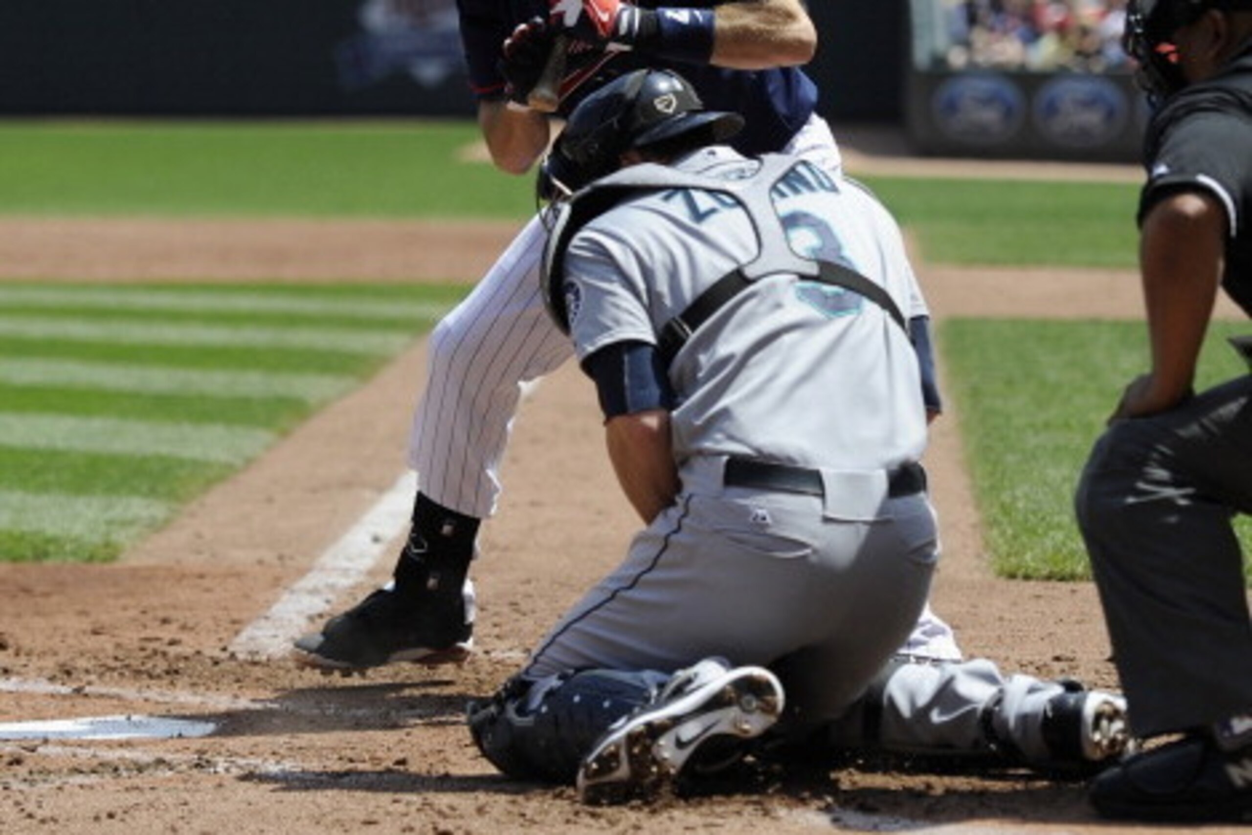 MINNEAPOLIS, MN - MAY 18: The ball gets away from Mike Zunino #3 of the Seattle Mariners as Joe Mauer #7 of the Minnesota Twins bats during the third inning of the game on May 18, 2014 at Target Field in Minneapolis, Minnesota. The Mariners defeated the T