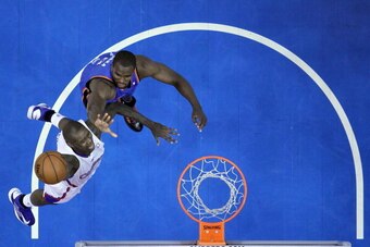 LOS ANGELES, CA - JANUARY 22:  Jamal Crawford #11 of the Los Angeles Clippers drives to the basket on Serge Ibaka #9 of the Oklahoma City Thunder at Staples Center on January 22, 2013 in Los Angeles, California.  NOTE TO USER: User expressly acknowledges 