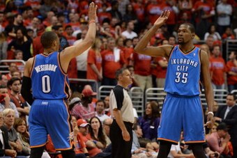 LOS ANGELES, CA - MAY 15: Russell Westbrook #0 and Kevin Durant #35 of the Oklahoma City Thunder celebrate in Game Six of the Western Conference Semifinals against the Los Angeles Clippers  during the 2014 NBA Playoffs at Staples Center on May 15, 2014 in