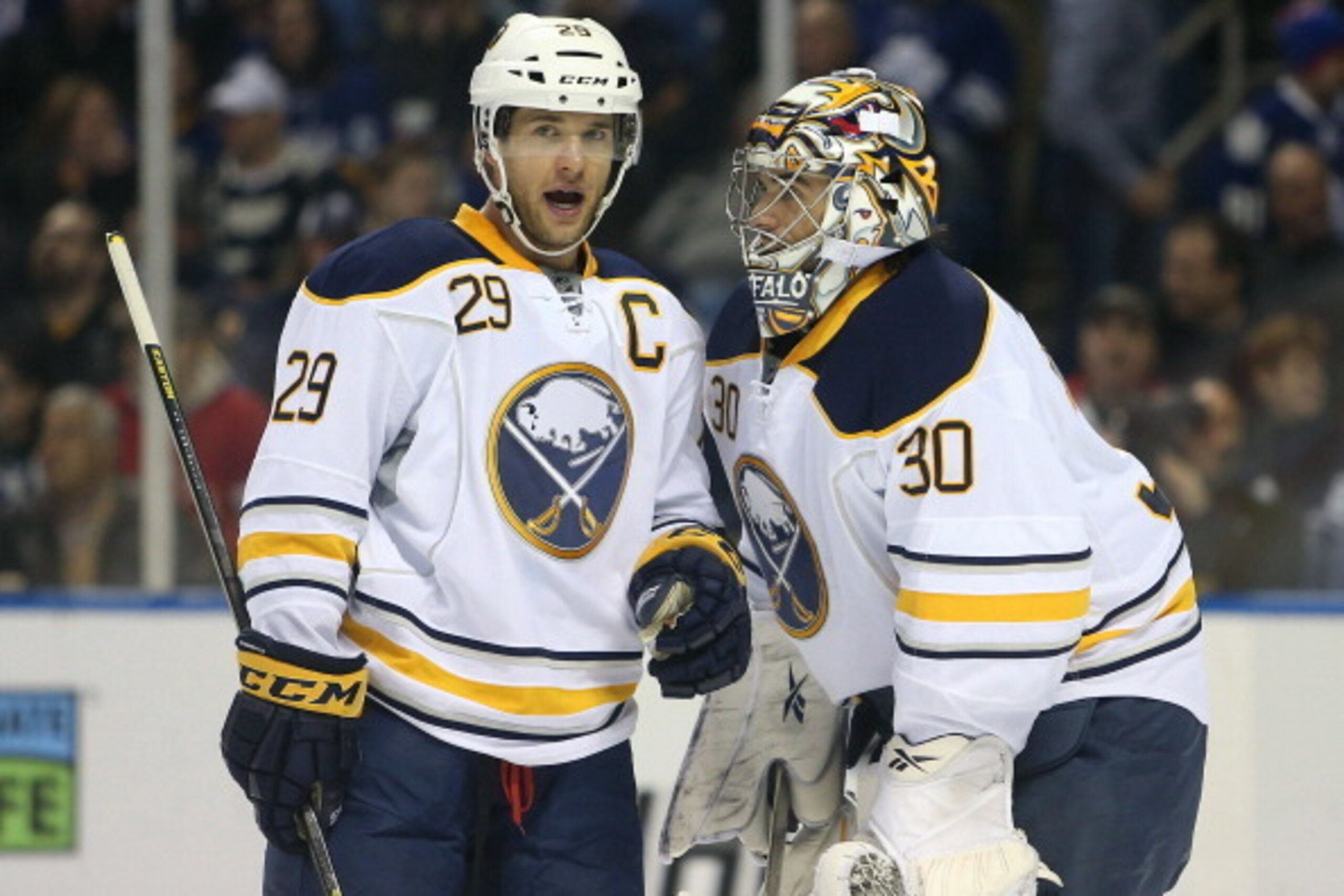 BUFFALO, NY - JANUARY 29:  Jason Pominville #29 of the Buffalo Sabres talks to Ryan Miller #30 after scoring a goal during an NHL game against the Toronto Maple Leafs at First Niagara Center on January 29, 2013 in Buffalo, New York. (Photo by Tom Szczerbo