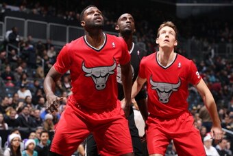 BROOKLYN, NY - DECEMBER 25:  Nazr Mohammed #48 and Mike Dunleavy #34 of the Chicago Bulls box out Kevin Garnett #2 of the Brooklyn Nets during the Christmas Day game on December 25, 2013 at Barclays Center in Brooklyn, New York. NOTE TO USER: User express