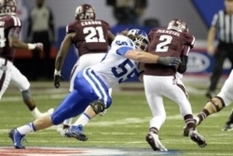 Dec 31, 2013; Atlanta, GA, USA;  Duke Blue Devils linebacker Kelby Brown (59) sacks Texas A&M Aggies quarterback Johnny Manziel (2) during the first quarter in the 2013 Chick-fil-a Bowl at the Georgia Dome. Mandatory Credit: John David Mercer-USA TODAY Sp