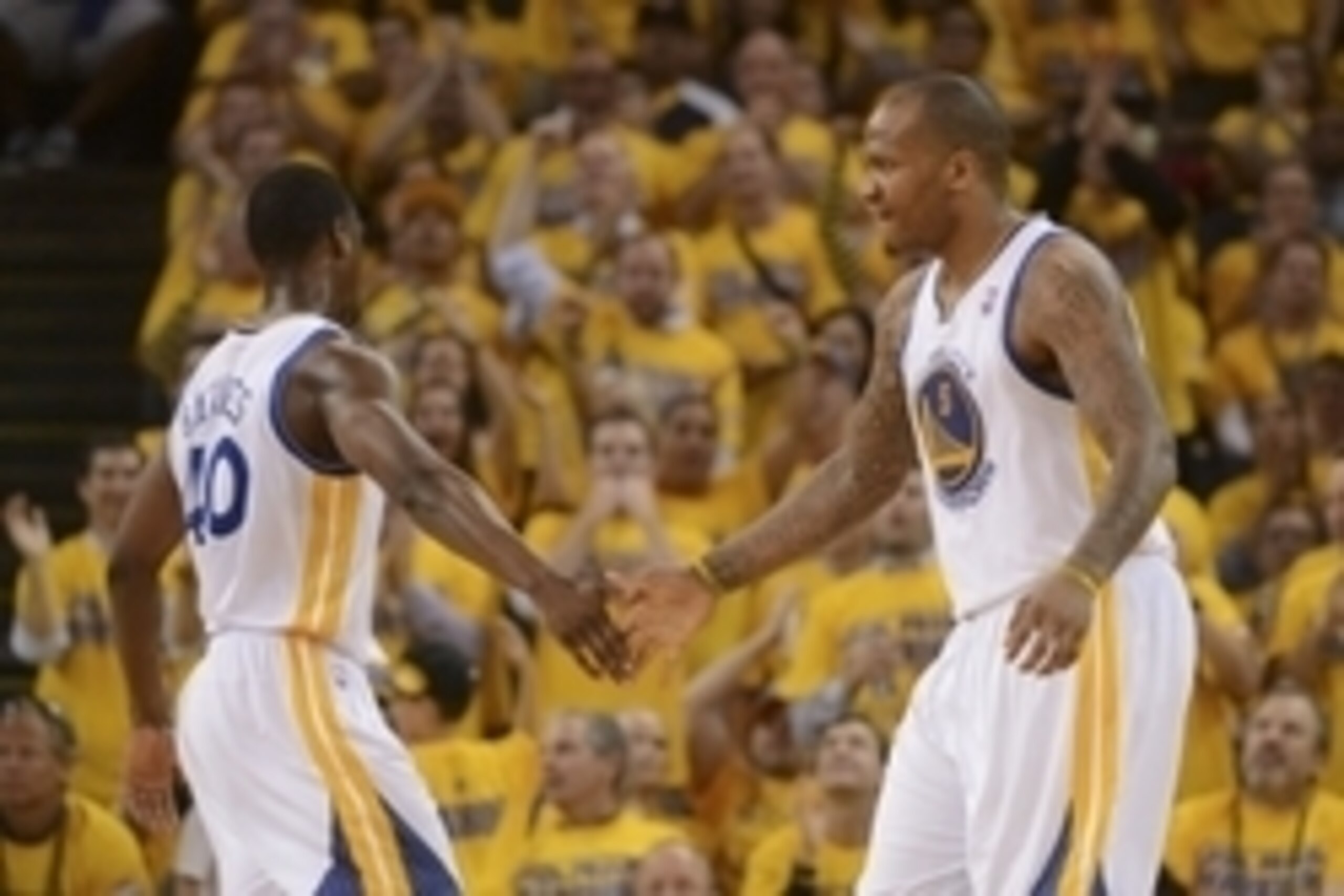 May 1, 2014; Oakland, CA, USA; Golden State Warriors forward Harrison Barnes (40) congratulates forward Marreese Speights (5) against the Los Angeles Clippers during the fourth quarter in game six of the first round of the 2014 NBA Playoffs at Oracle Aren