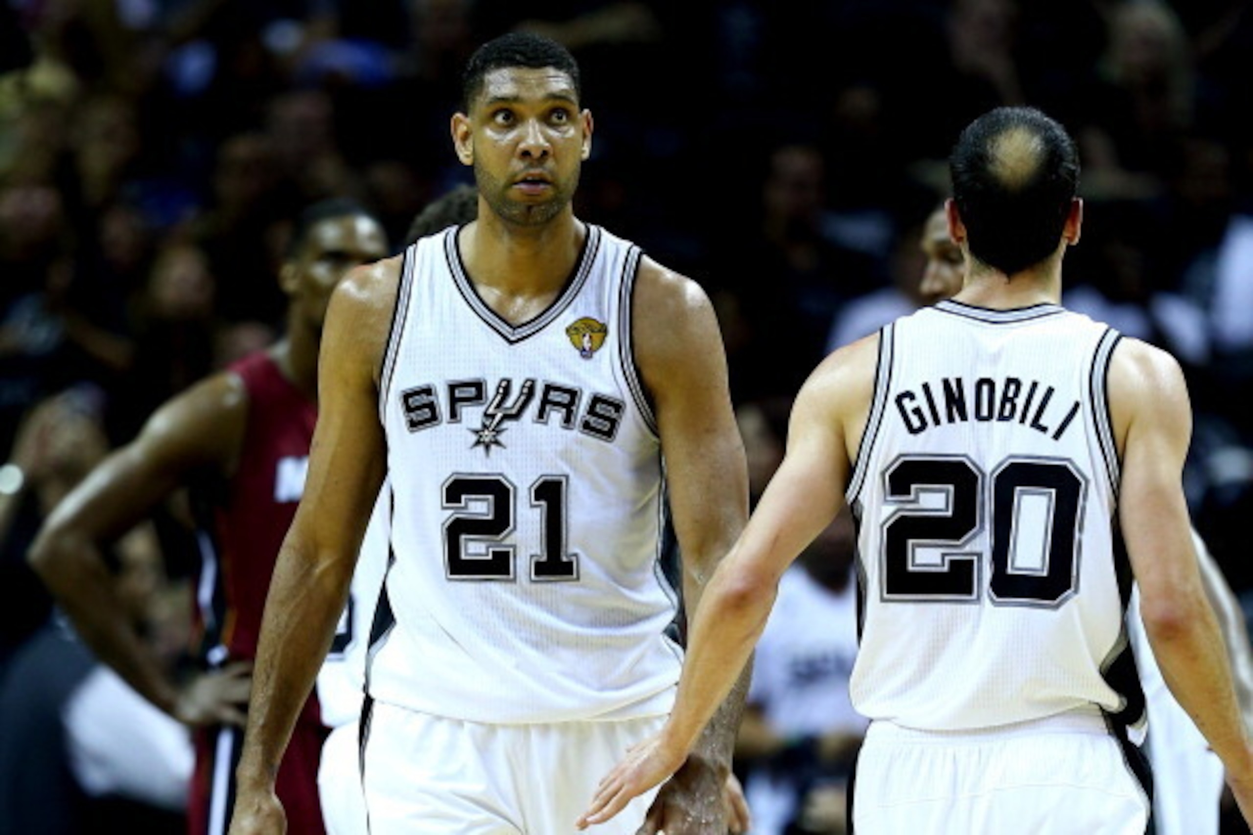 SAN ANTONIO, TX - JUNE 05: Tim Duncan #21 celebrates with Manu Ginobili #20 of the San Antonio Spurs against the Miami Heat during Game One of the 2014 NBA Finals at the AT&T Center on June 5, 2014 in San Antonio, Texas. NOTE TO USER: User expressly ackno