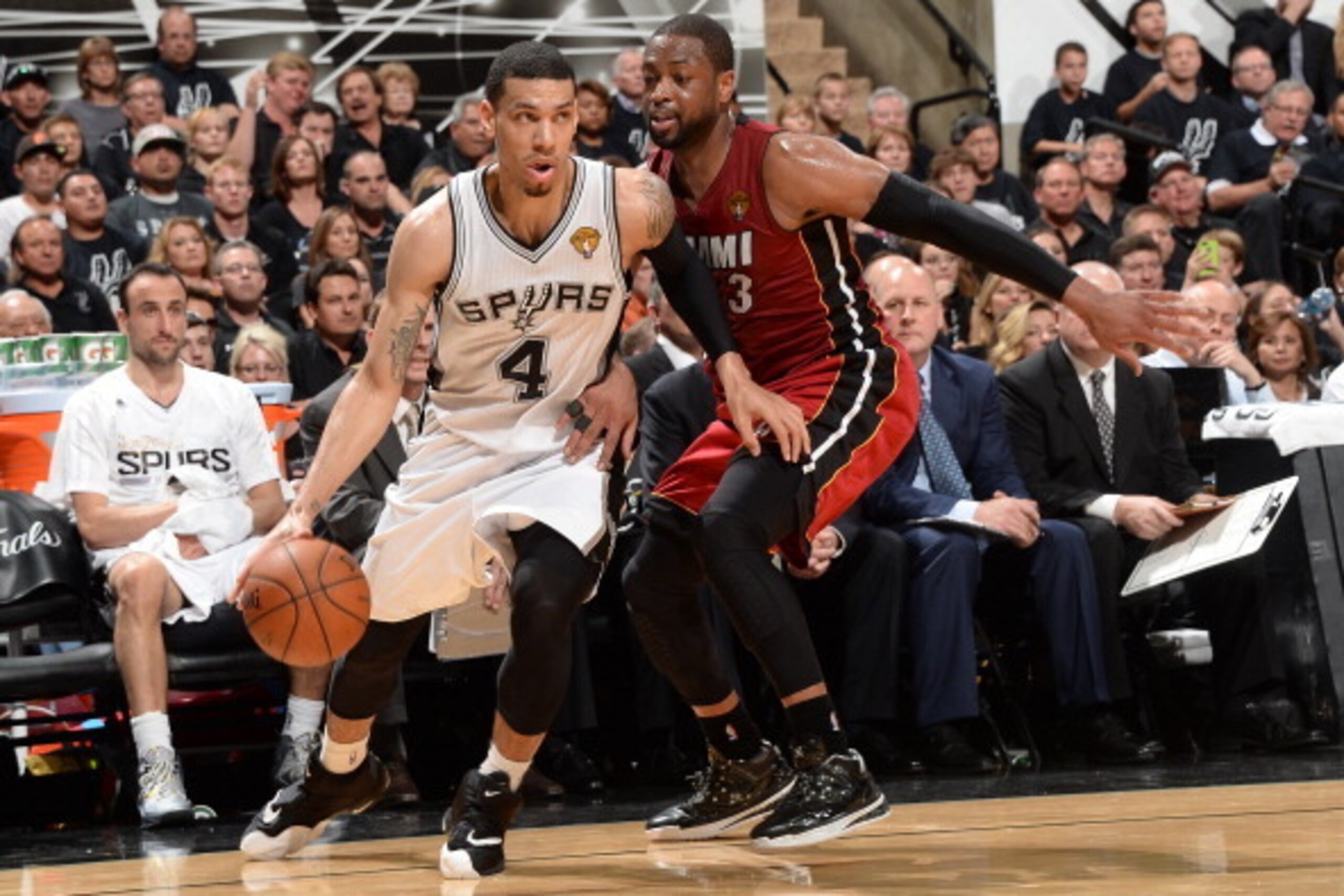 SAN ANTONIO, TX - JUNE 05: Danny Green #4 of the San Antonio Spurs drives to the basket against Dwyane Wade #3 of the Miami Heat during Game One of the 2014 NBA Finals between the Miami Heat and San Antonio Spurs at AT&T Center on June 5, 2014 in San Anto