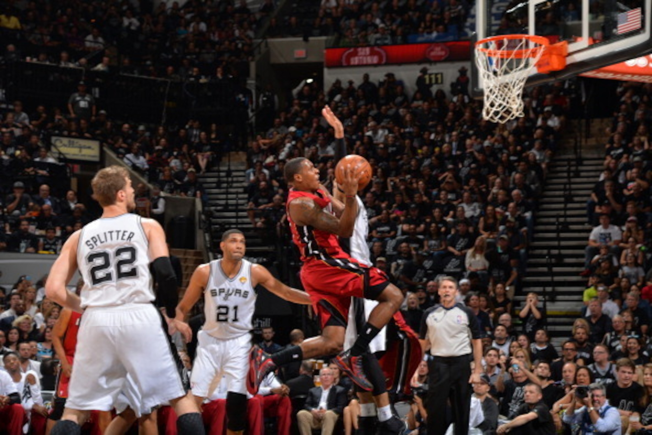 SAN ANTONIO, TX - JUNE 5: Mario Chalmers #15 of the Miami Heat goes up for the layup against the San Antonio Spurs during Game One of the 2014 NBA Finals on June 5, 2014 at AT&T Center in San Antonio, Texas. NOTE TO USER: User expressly acknowledges and a