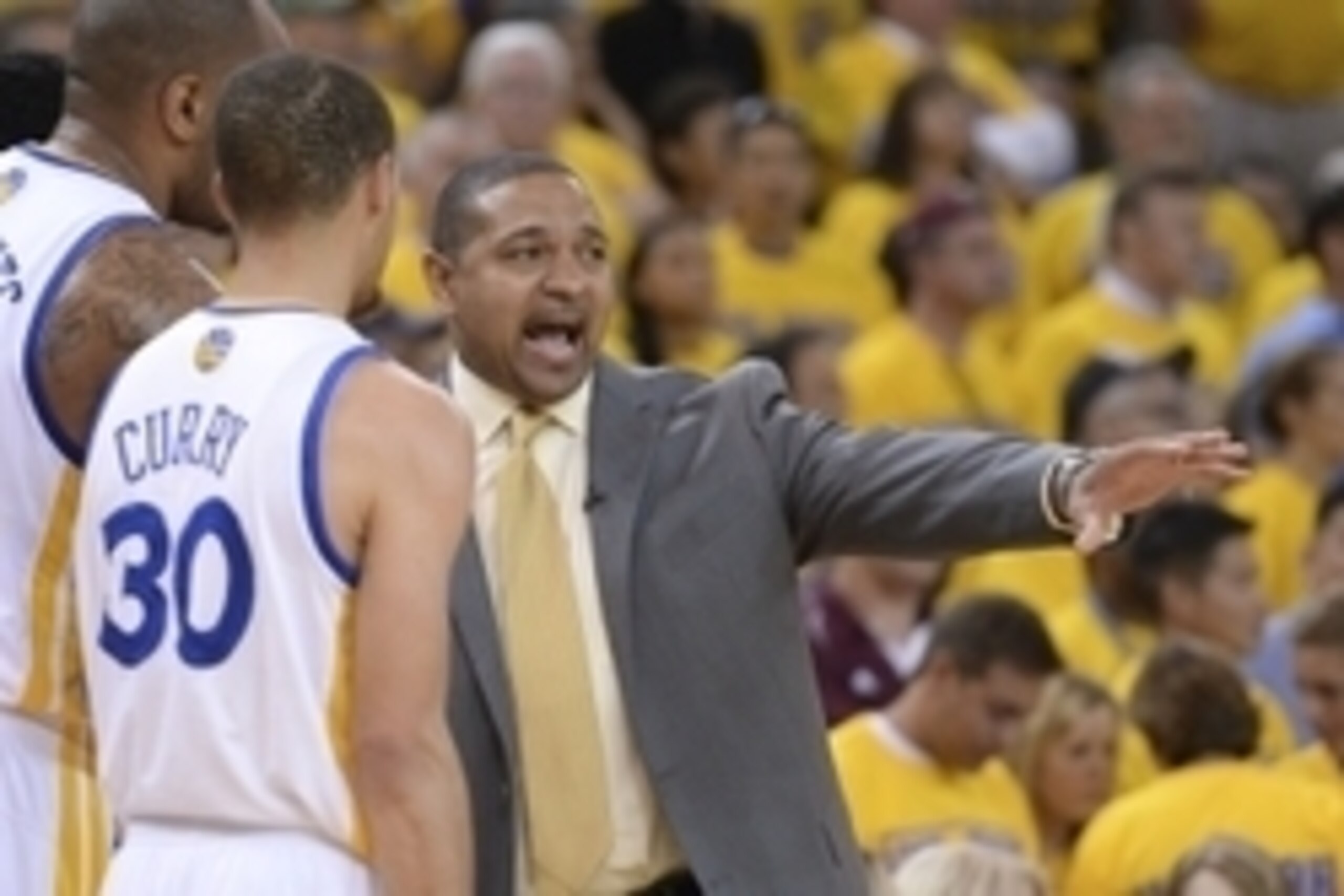 May 1, 2014; Oakland, CA, USA; Golden State Warriors head coach Mark Jackson (right) instructs guard Stephen Curry (30) against the Los Angeles Clippers during the second quarter in game six of the first round of the 2014 NBA Playoffs at Oracle Arena. Man