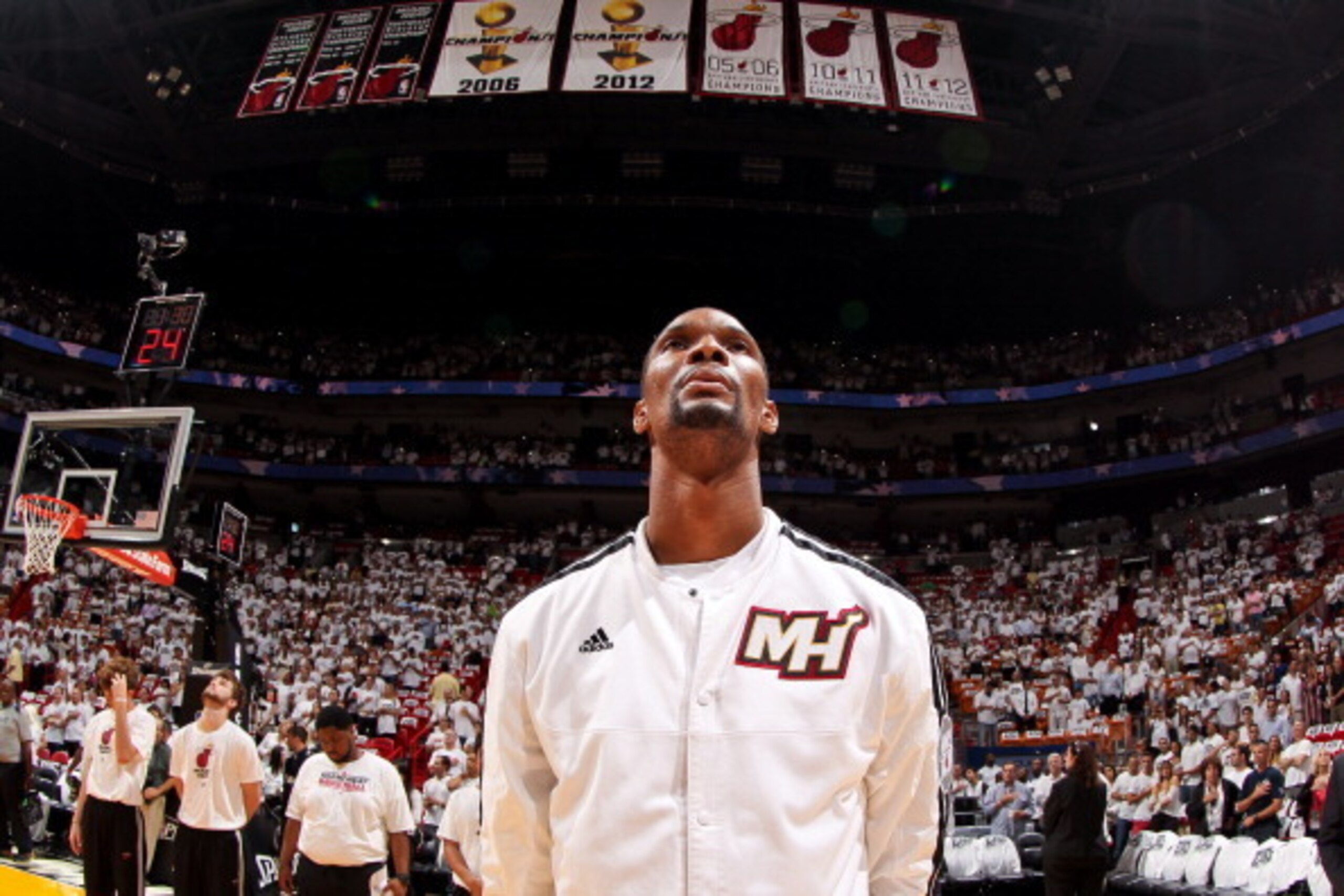 MIAMI, FL - MAY 15: Chris Bosh #1 of the Miami Heat, standing under the team's Championship banners, listens to the National Anthem before playing against the Miami Heat in Game Five of the Eastern Conference Semifinals during the 2013 NBA Playoffs on May MIAMI, FL - MAY 15: Chris Bosh #1 of the Miami Heat, standing under the team's Championship banners, listens to the National Anthem before playing against the Miami Heat in Game Five of the Eastern Conference Semifinals during the 2013 NBA Playoffs on May