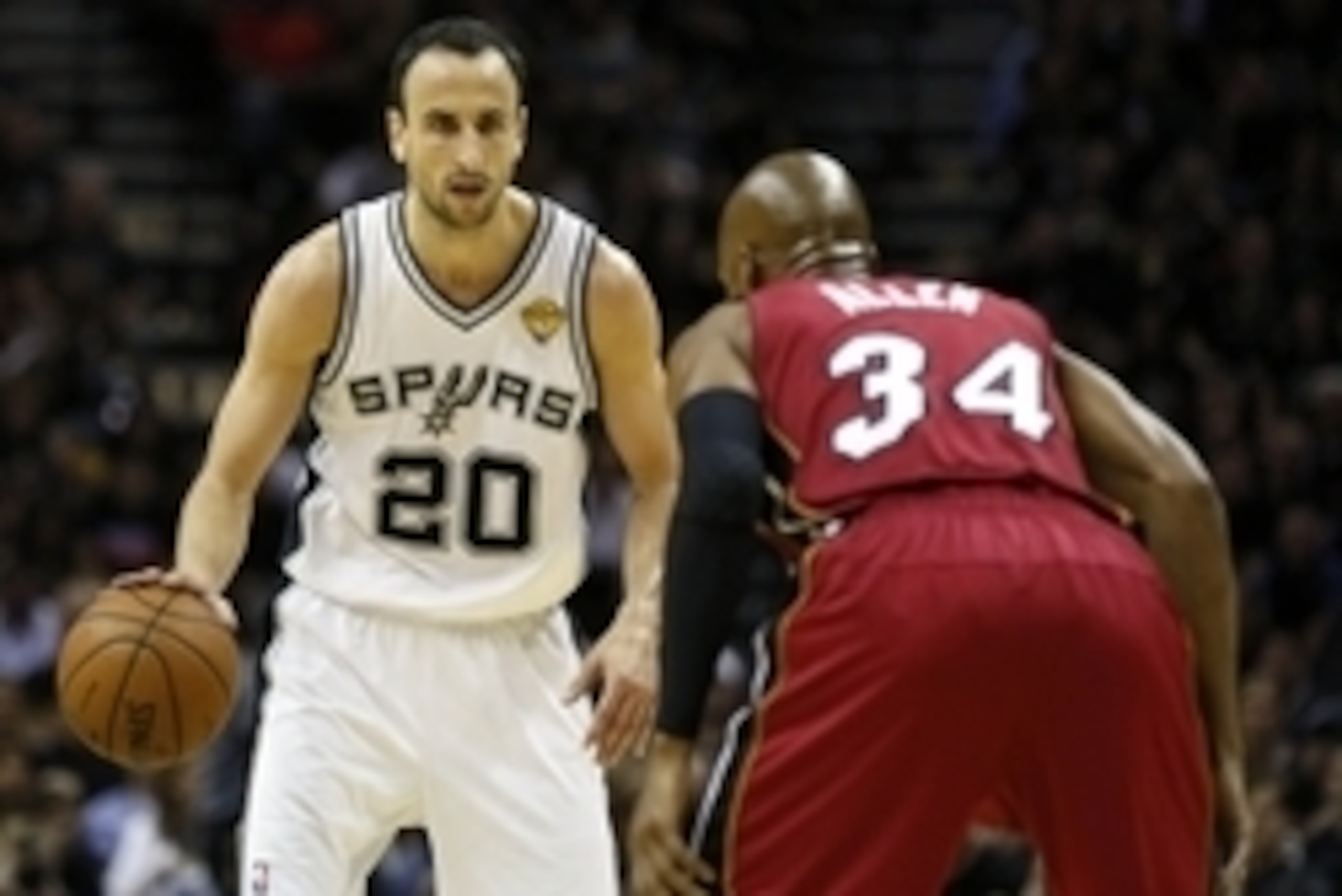 Jun 5, 2014; San Antonio, TX, USA; San Antonio Spurs guard Manu Ginobili (20) handles the ball aianst Miami Heat guard Ray Allen (34) during the first quarter in game one of the 2014 NBA Finals at AT&T Center. Mandatory Credit: Soobum Im-USA TODAY Sports