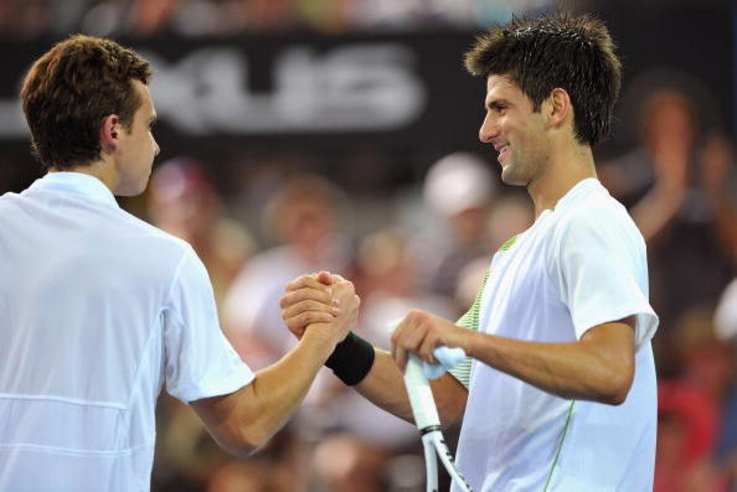 BRISBANE, AUSTRALIA - JANUARY 06:  Ernests Gulbis of Latvia is congratulated by Novak Djokovic of Serbia after Gulbis won the match during day three of the Brisbane International 2009 at the State Tennis Centre on January 6, 2009 in Brisbane, Australia.  