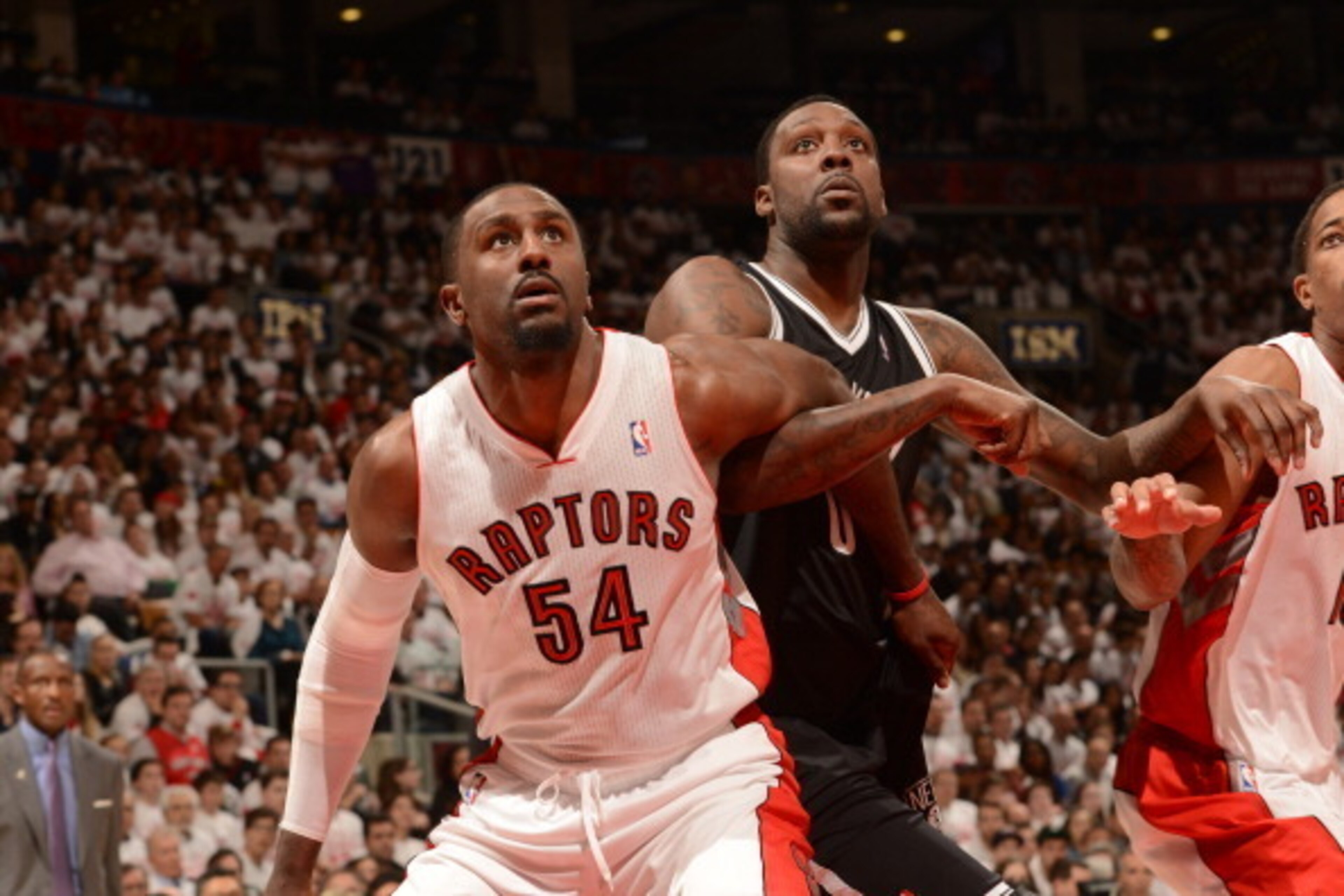 TORONTO, CANADA - APRIL 19:  Patrick Patterson #54 of the Toronto Raptors boxes out during Game One of the Eastern Conference Quarterfinals against the Brooklyn Nets of the 2014 NBA playoffs on April 19, 2014 at the Air Canada Centre in Toronto, Ontario, 