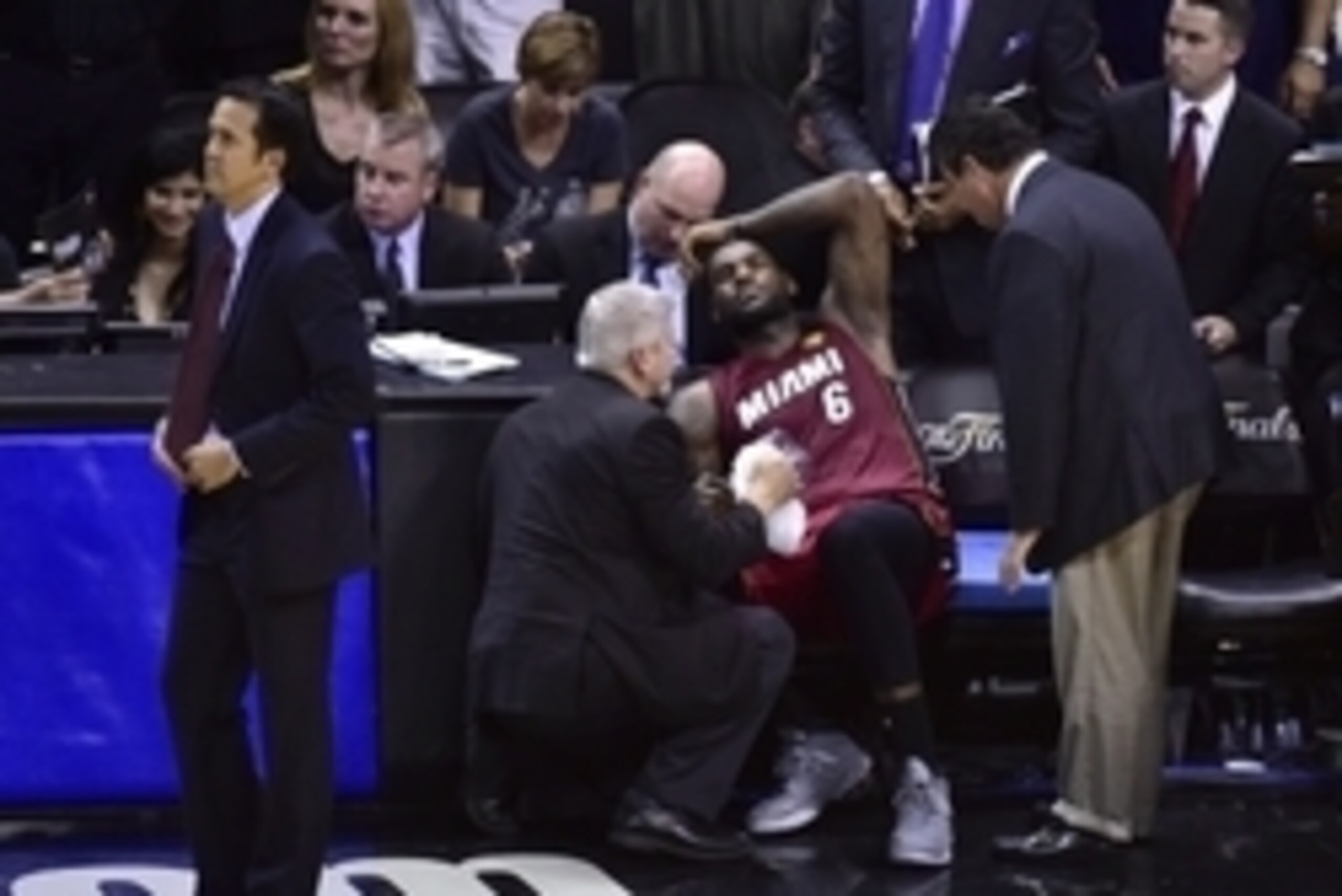 Jun 5, 2014; San Antonio, TX, USA; Miami Heat forward LeBron James (6) reacts on the bench after an injury in the fourth quarter against the San Antonio Spurs in game one of the 2014 NBA Finals at AT&T Center. The Spurs beat the Heat 110-95.  Mandatory Cr
