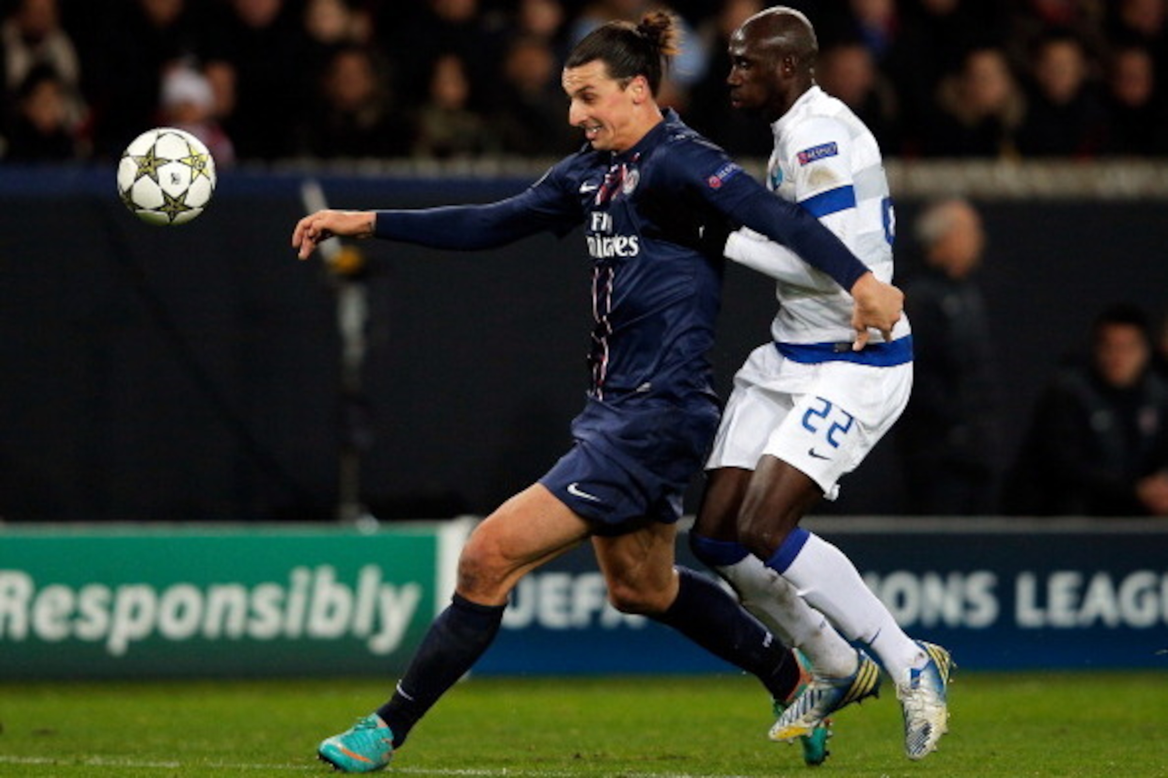 PARIS, FRANCE - DECEMBER 04:  Zlatan Ibrahimovic  of PSG and Eliaquim Mangala of Porto battle for the ball during the Group A UEFA Champions League match between Paris Saint-Germain FC and FC Porto at Parc des Princes on December 4, 2012 in Paris, France.
