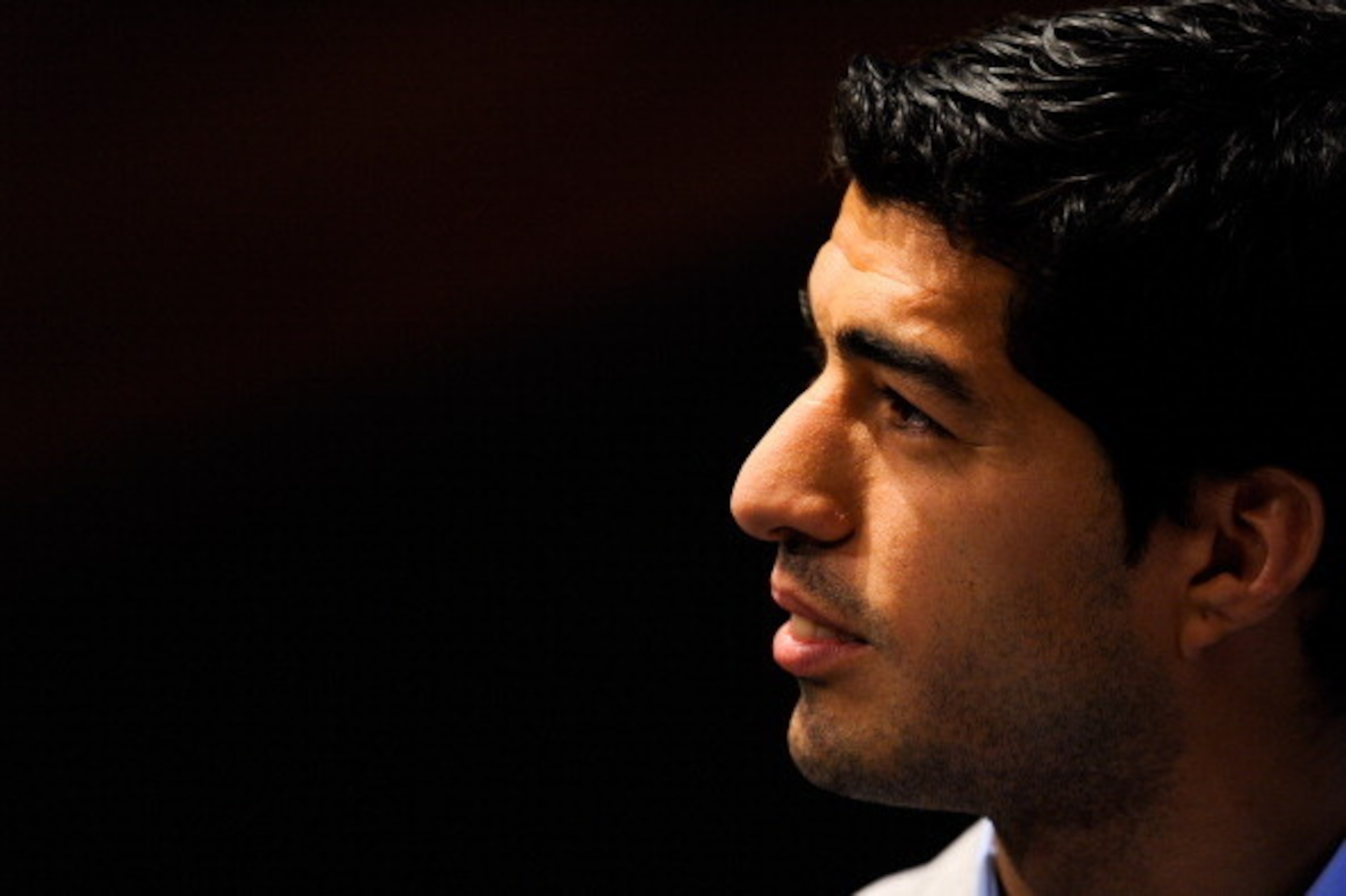 BARCELONA, SPAIN - MAY 14:  Luis Suarez of Liverpool faces the media during the presentation as new Ambassador for 888poker on May 14, 2014 in Barcelona, Spain.  (Photo by David Ramos/Getty Images)